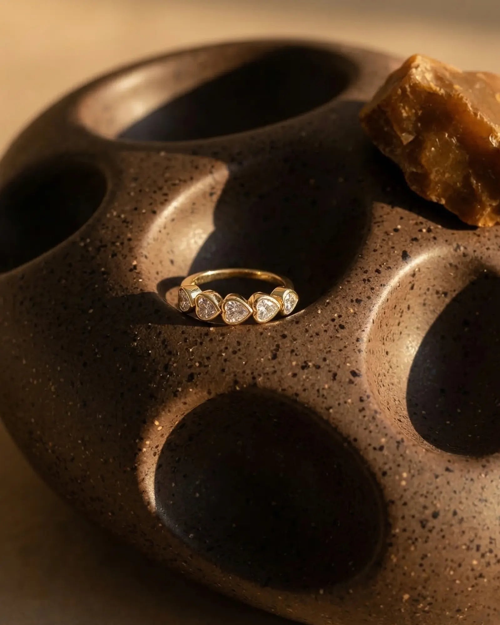 timeless-modern-aesthetic-baguette-ring-gold, 18k-gold-vermeil-finish-detail-siena-pendant, gift-ideas-for-women-sparkling-geometric-jewelry, luxury-boutique-jewelry-netherlands, artistic-jewelry-flatlay-photography