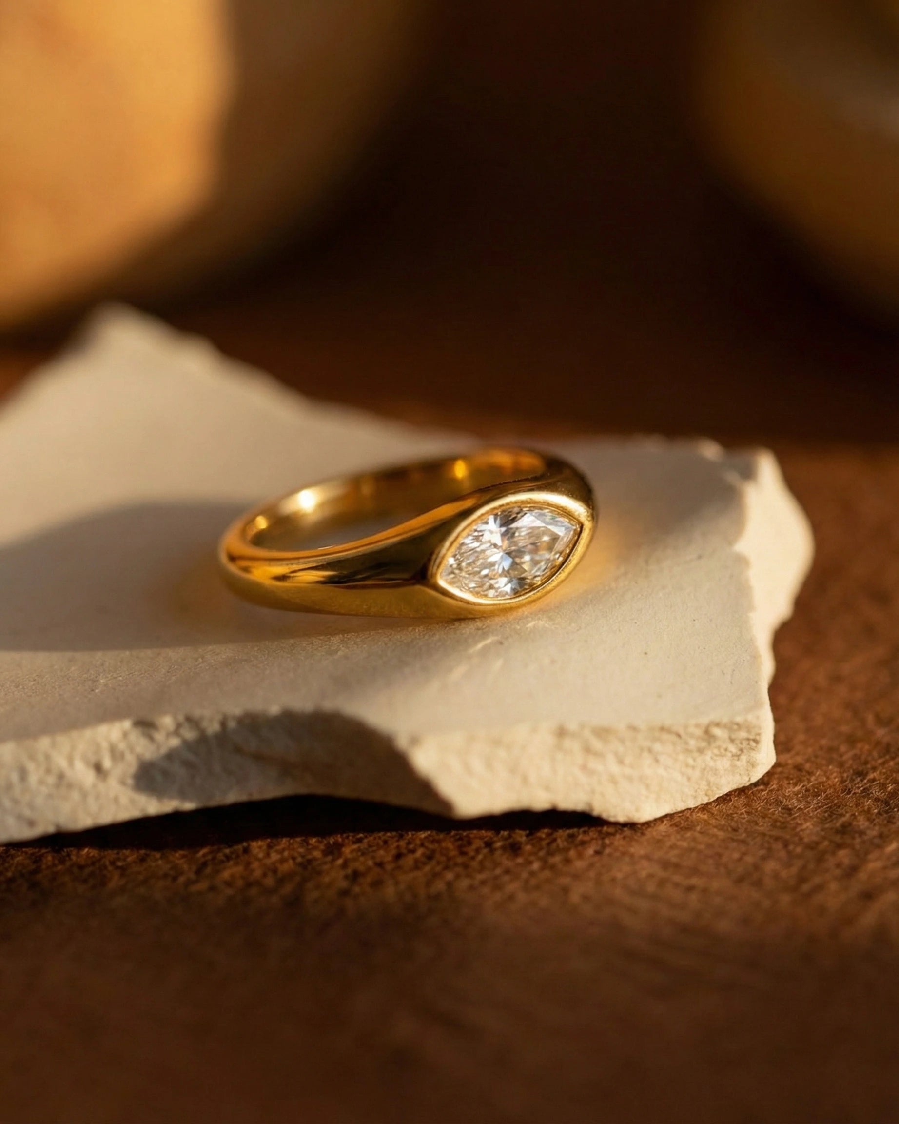 timeless-modern-aesthetic-marquise-ring-design, 18k-gold-pvd-finish-detail-selah-ring, gift-ideas-for-women-bold-jewelry, luxury-boutique-jewelry-netherlands, artistic-jewelry-flatlay-photography