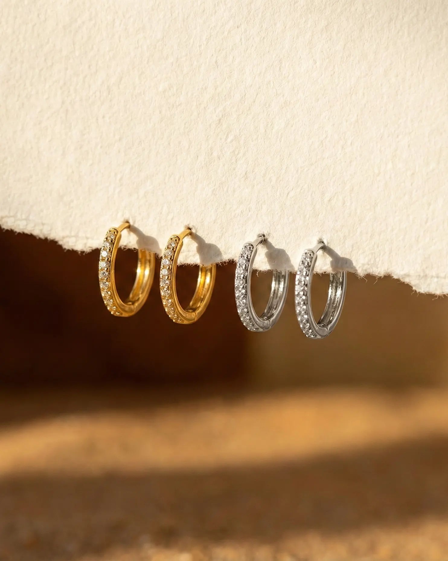 timeless-sparkling-earrings-modern-aesthetic, 925-sterling-silver-detail-emery-hoops, gift-ideas-for-women-sophisticated-jewelry, luxury-boutique-jewelry-netherlands, artistic-jewelry-flatlay-photography