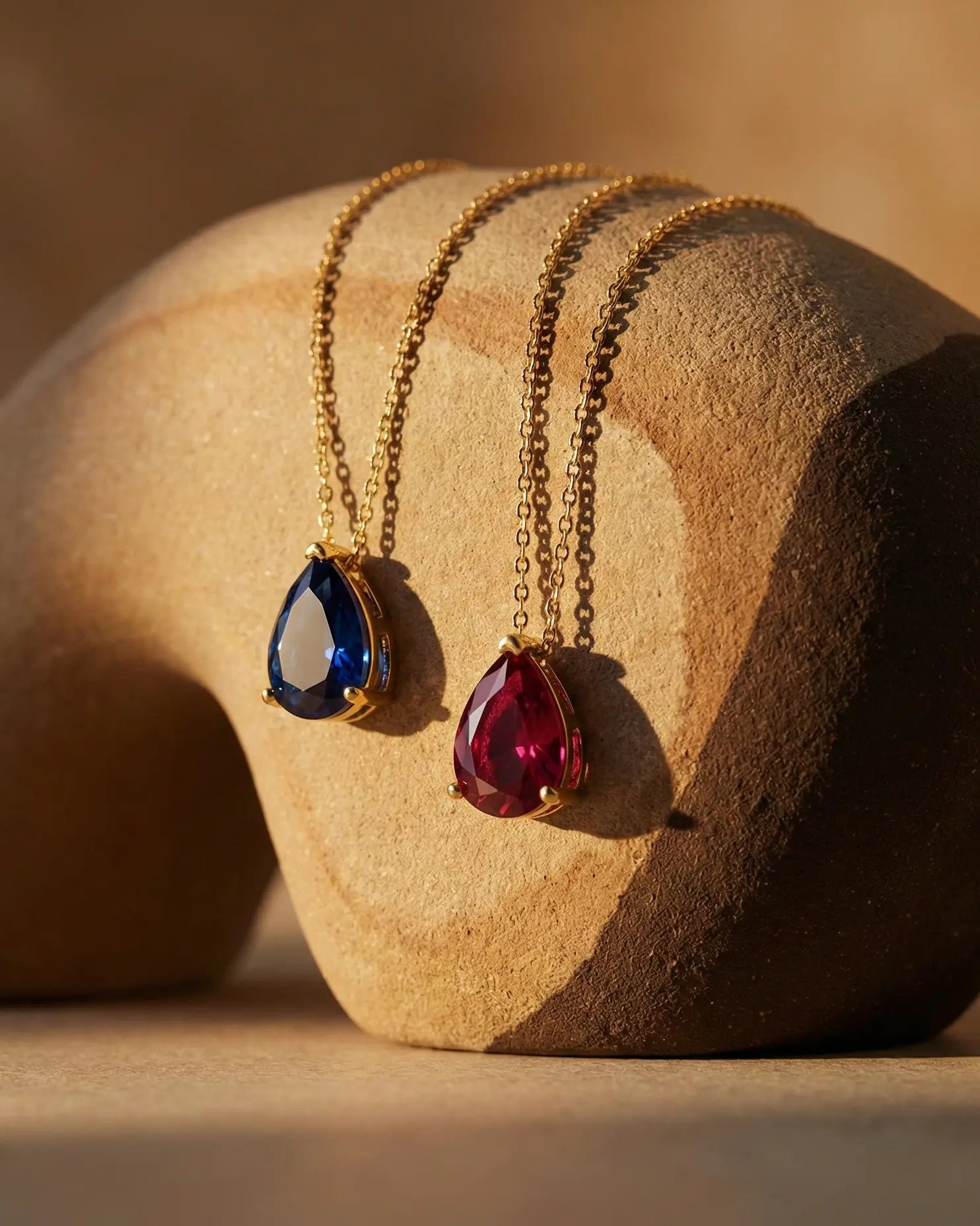 timeless-teardrop-necklace-modern-aesthetic, 18k-gold-PVD-plating-detail, gift-ideas-for-women-birthstone-jewelry, high-clarity-pear-cut-zirconia-europe, luxury-boutique-jewelry-netherlands, artistic-jewelry-flatlay-photography