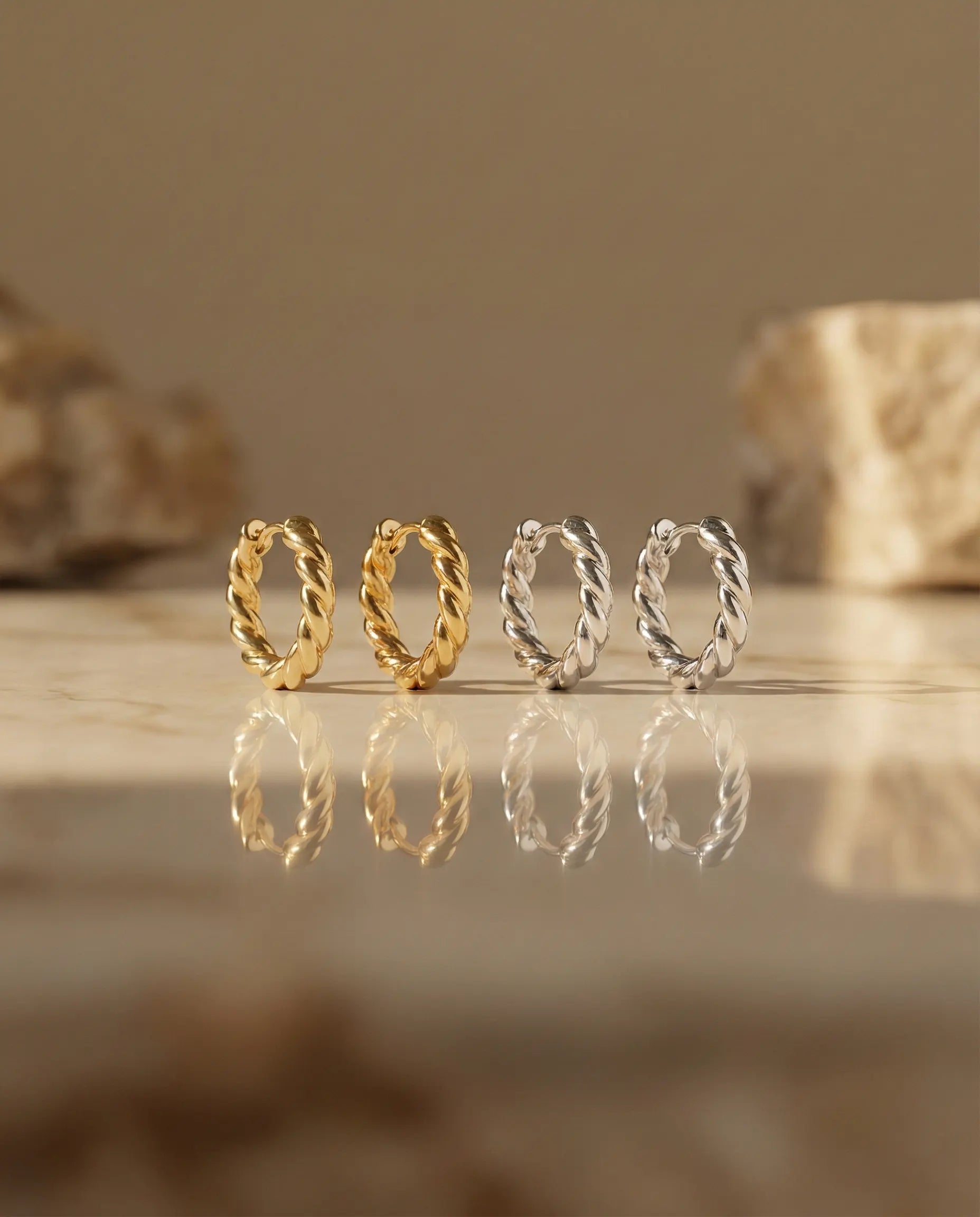 timeless-twisted-rope-earrings-modern-aesthetic, 18k-gold-vermeil-huggies-detail, gift-ideas-for-women-textured-jewelry, high-shine-925-silver-hoops-europe, luxury-boutique-jewelry-netherlands, artistic-jewelry-flatlay-photography