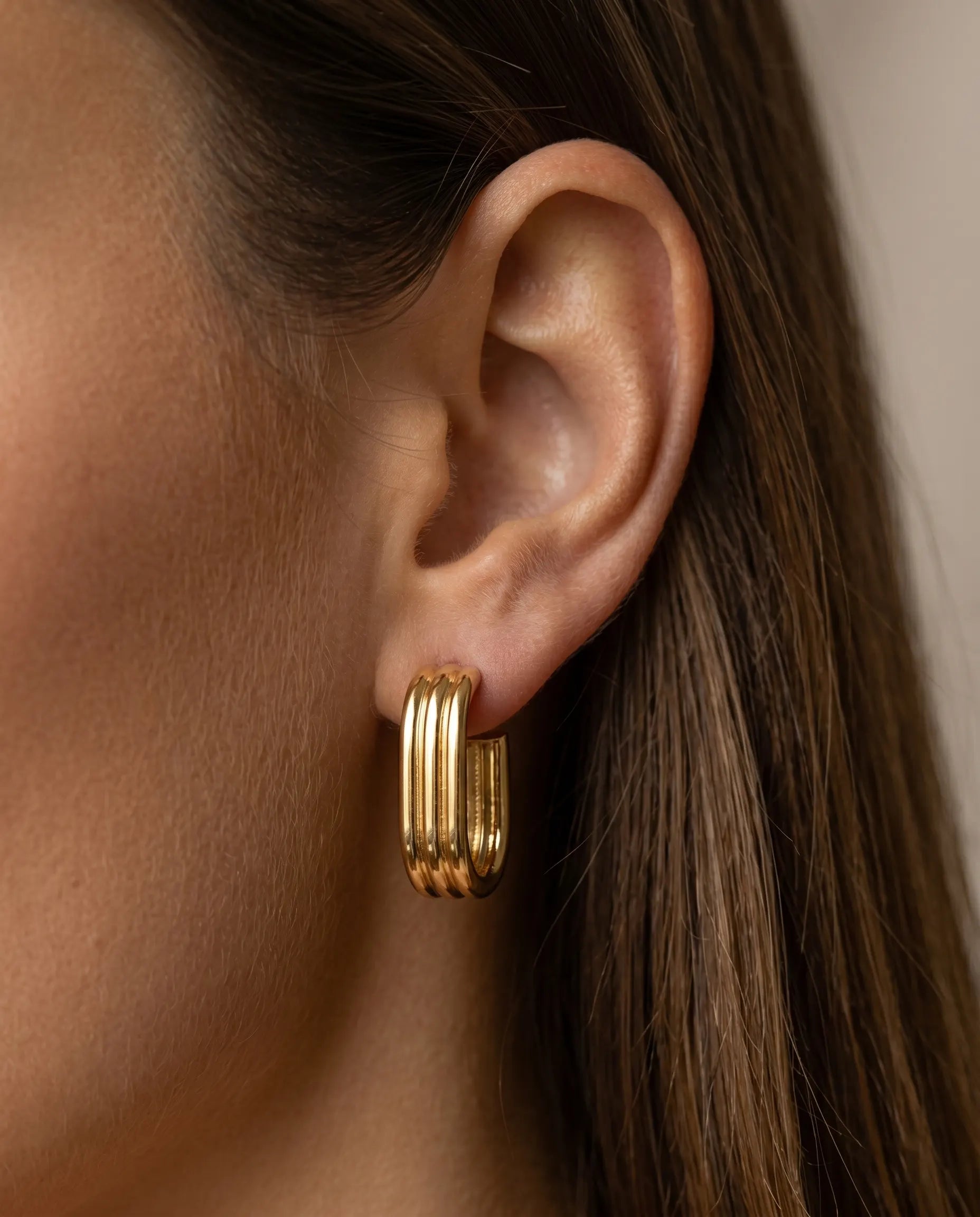 versatile-daily-wear-gold-ursula-statement-hoops, effortless-high-end-industrial-luxe-style, minimalist-accessories-for-refined-look, classy-waterproof-geometric-earrings-lifestyle, senya-jewelry-ursula-collection