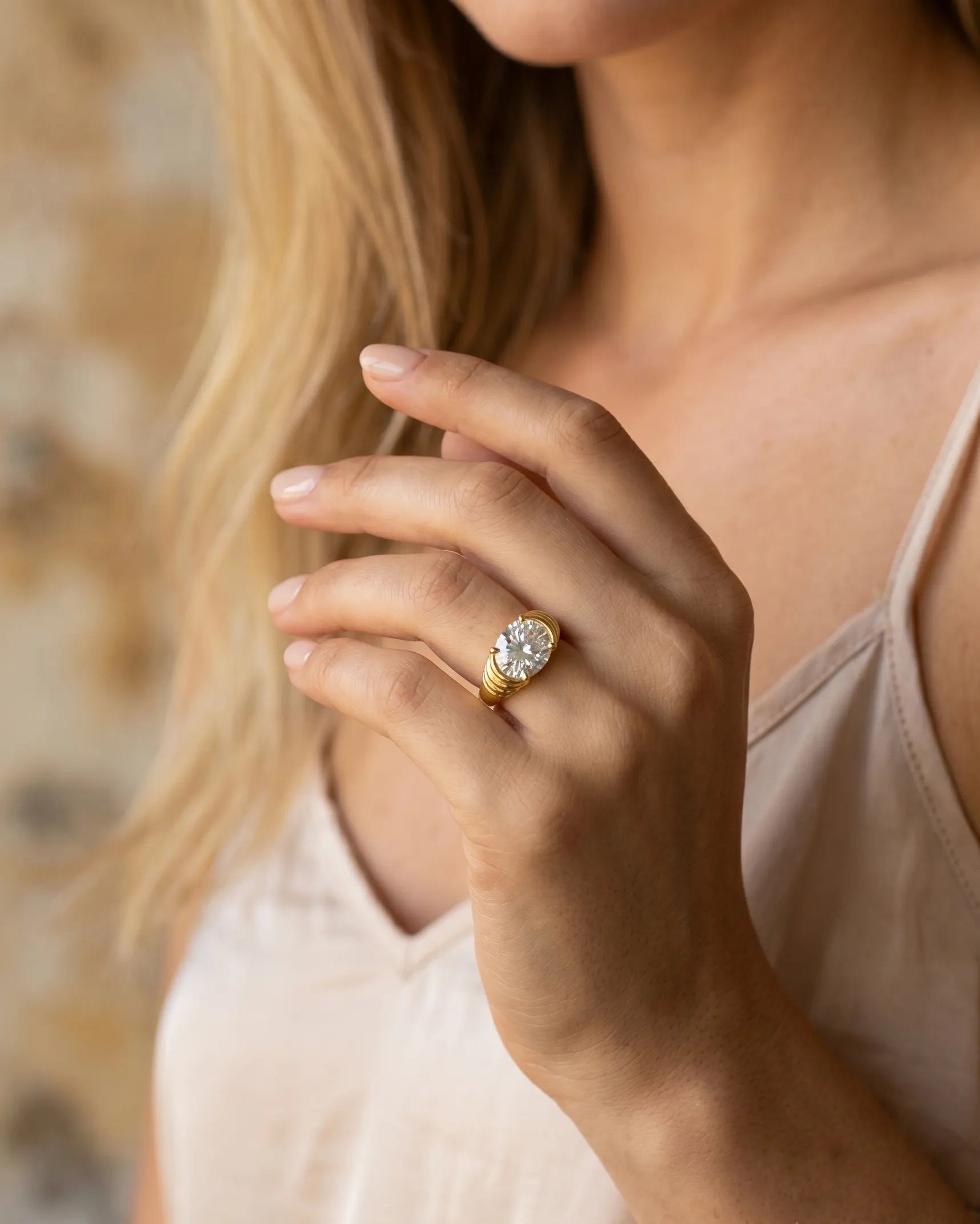 model-wearing-silver-vilhena-oval-statement-ring-lifestyle, elegant-modern-feminine-jewelry-on-hand, professional-women-luxury-accessories, chic-solitaire-silver-styling, luxury-lifestyle-brand-model