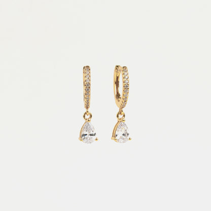 Hoop earrings with white zirconias, Zirconia-filled hoop earrings, Earrings with pear-shaped zirconia, White zirconia hoop earrings, Hoop earrings with pear-shaped gemstone,