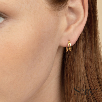 how to clean gold hoop earrings, can I sleep in huggie earrings, do huggie earrings stay in, unique gold hoop earring designs, how to style gold huggie earrings,