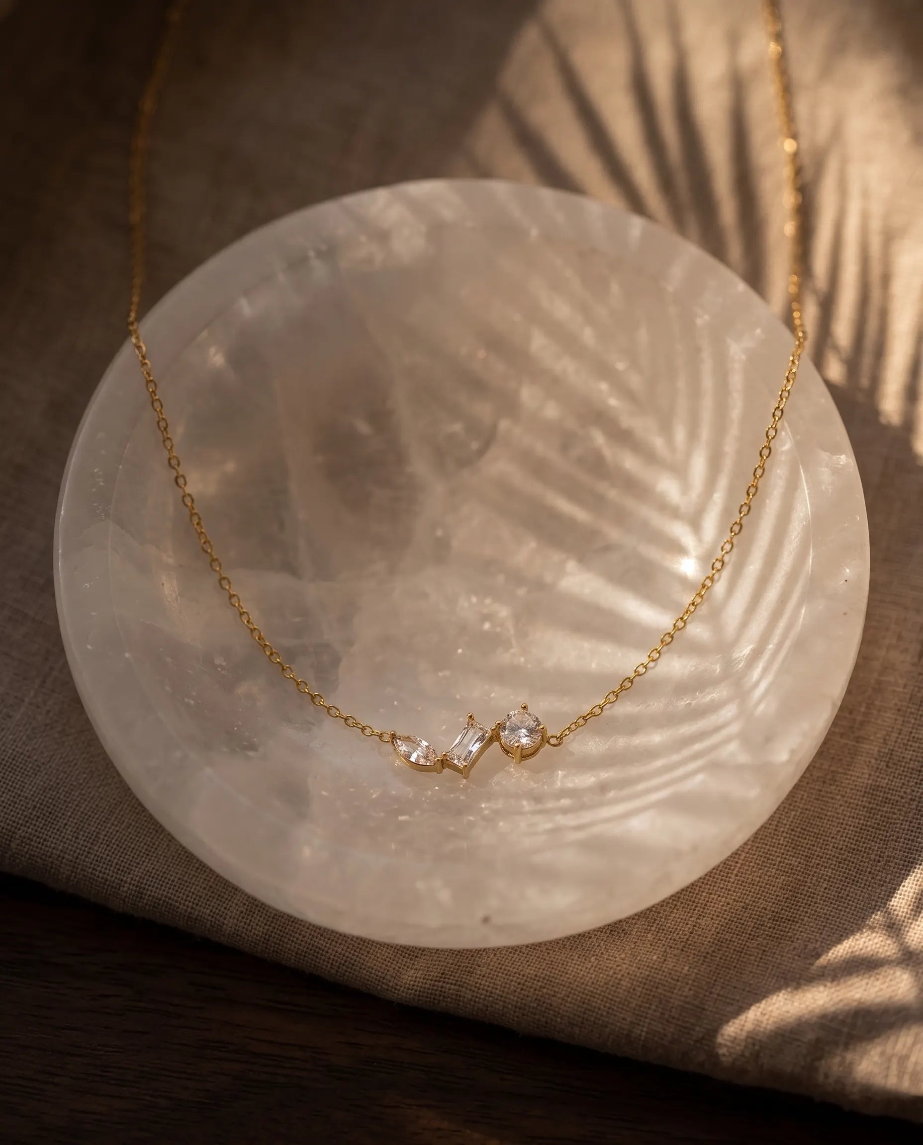 aesthetic-gold-necklace-with-brilliant-cut-crystals-lifestyle, luxury-tarnish-free-jewelry-for-women-europe, sophisticated-minimalist-gold-jewelry-photography