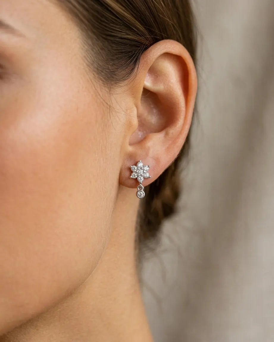 closeup-front-view-model-wearing-silver-sakura-drop-earrings, glowing-elegant-daily-wear-silver-jewelry-europe, luxury-women-professional-jewelry, feminine-botanical-statement-studs