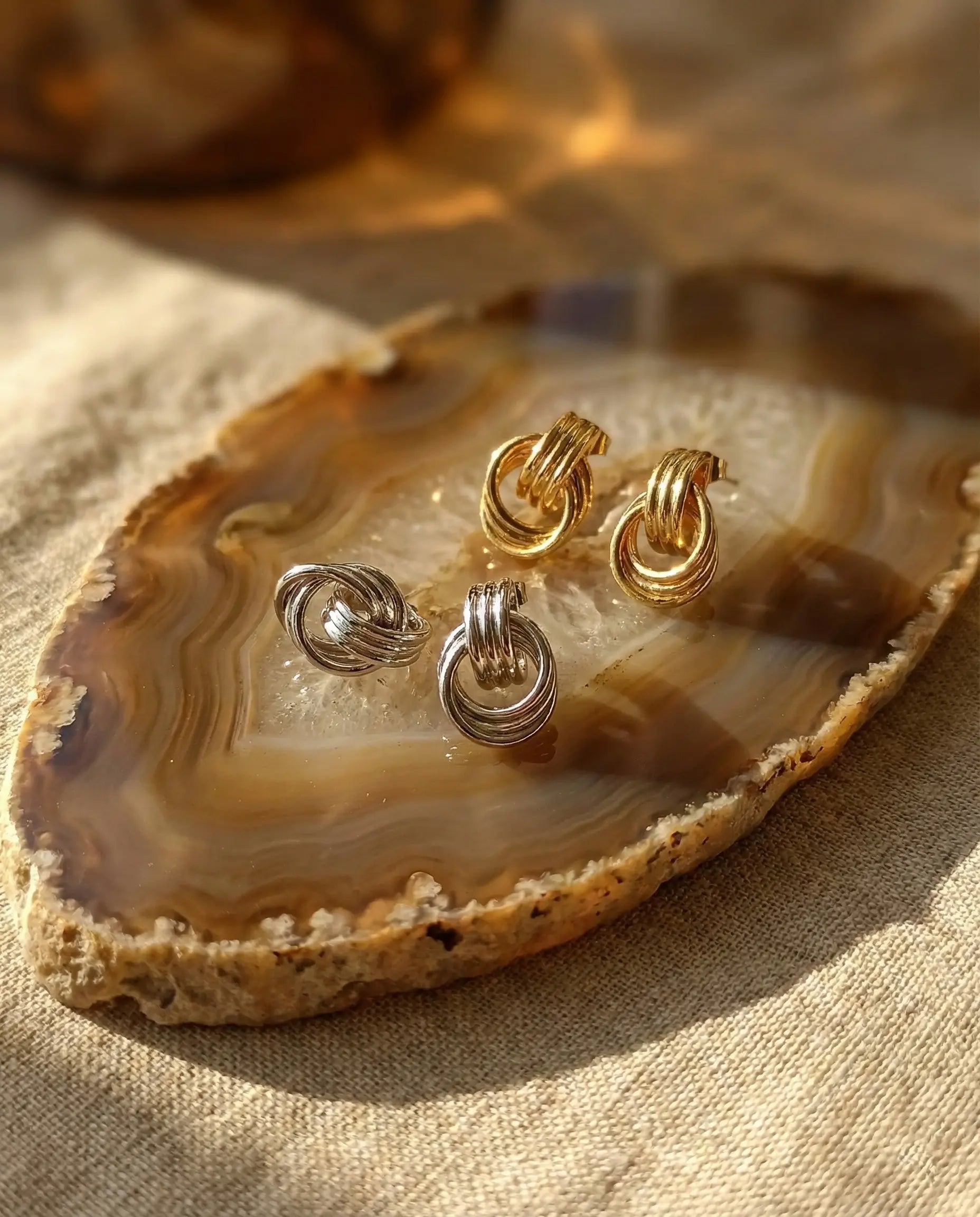 durable-waterproof-double-hoop-earrings-tarnish-free, intertwined-texture-gold-and-silver-hoops, high-quality-gold-pvd-plating, anti-allergy-steel-jewelry-premium, refined-jewelry-collection-germany, sustainable-luxury-jewelry-styling