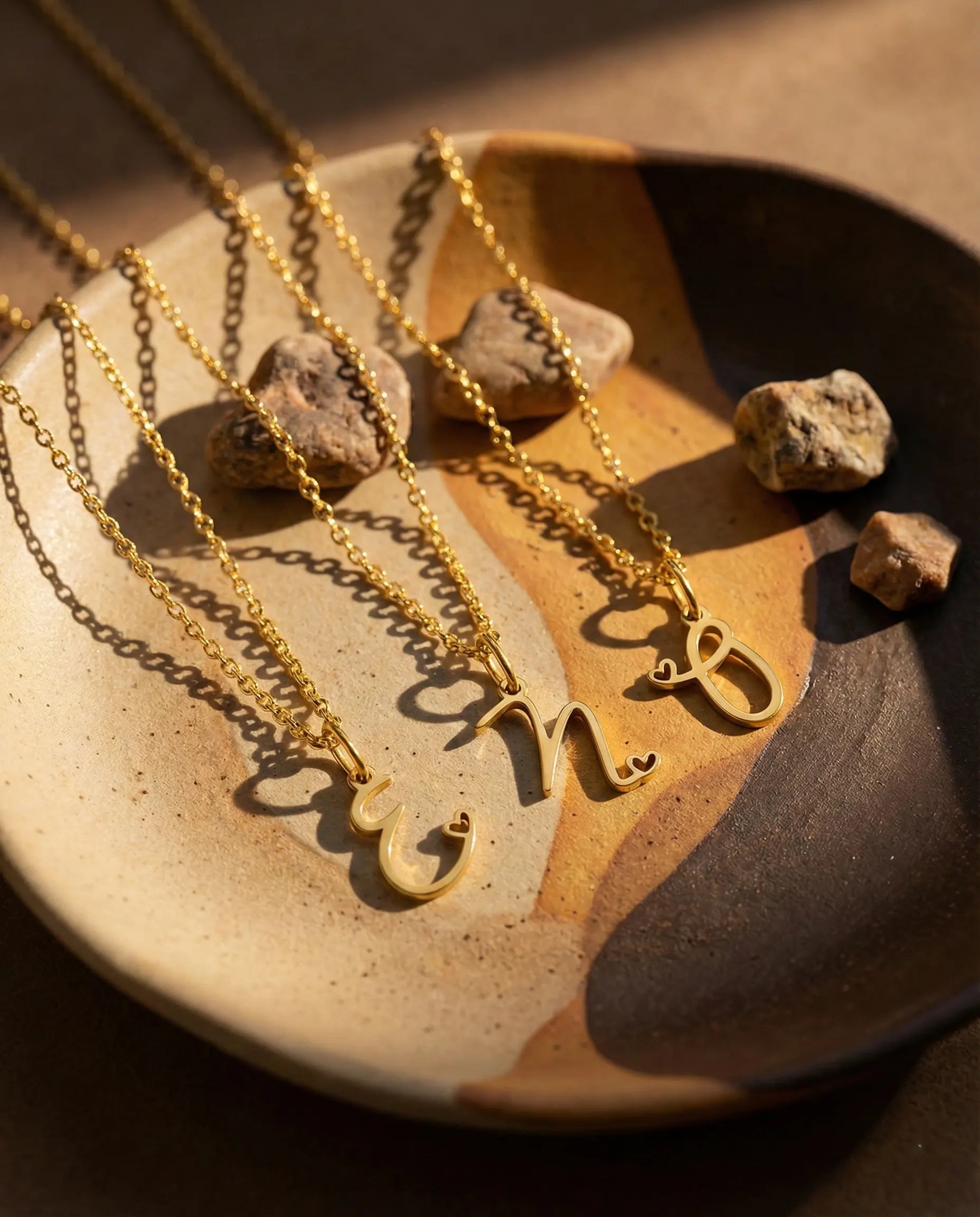 durable-waterproof-initial-pendant-necklace-tarnish-free, sophisticated-script-font-design-detail, real-18k-gold-pvd-plating-jewelry, anti-allergy-steel-necklace-premium, refined-jewelry-collection-germany