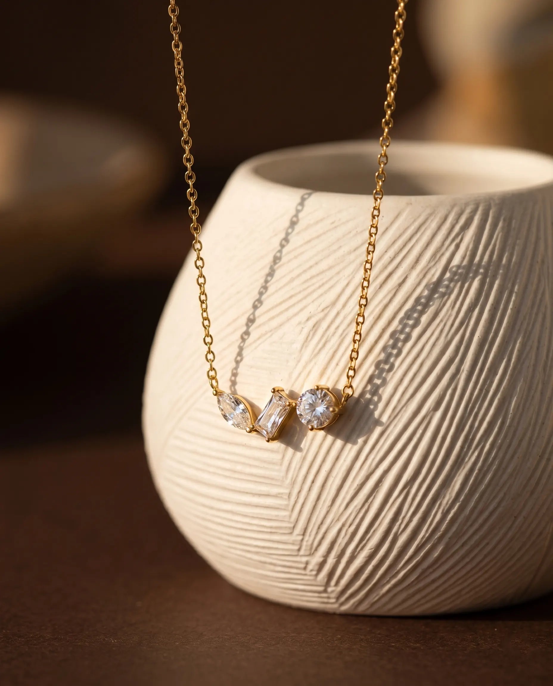 gold-crystal-necklace-detail-shot-minimalist-design, waterproof-stainless-steel-gold-jewelry-luxury-boutique, senya-jewelry-original-refined-necklace-styling