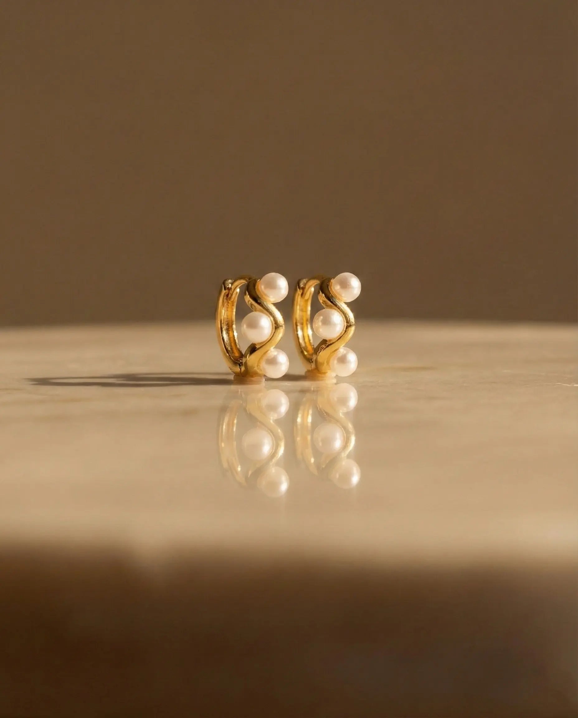 handcrafted-feel-pearl-jewelry-brand, unique-pearl-design-hoops, minimalist-jewelry-unboxing-aesthetic, high-end-fashion-pearl-earrings, versatile-jewelry-for-special-occasions, waterproof-gold-pearl-hoops