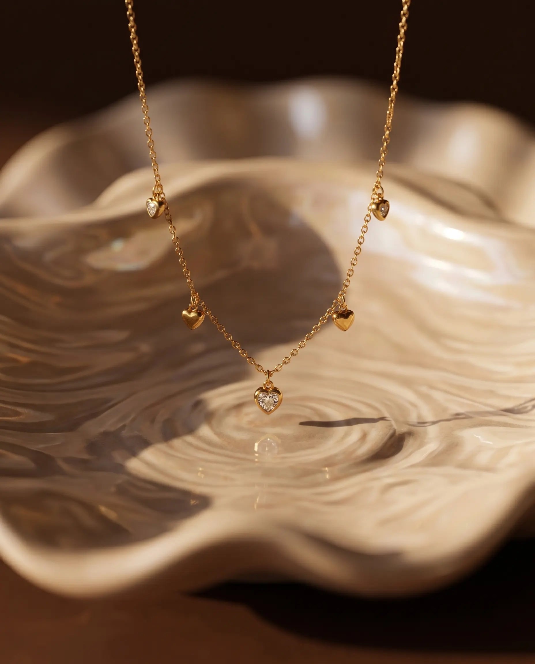 isabella-heart-station-necklace-featuring-five-gold-hearts-waterproof-minimalist-jewelry-design-by-senya