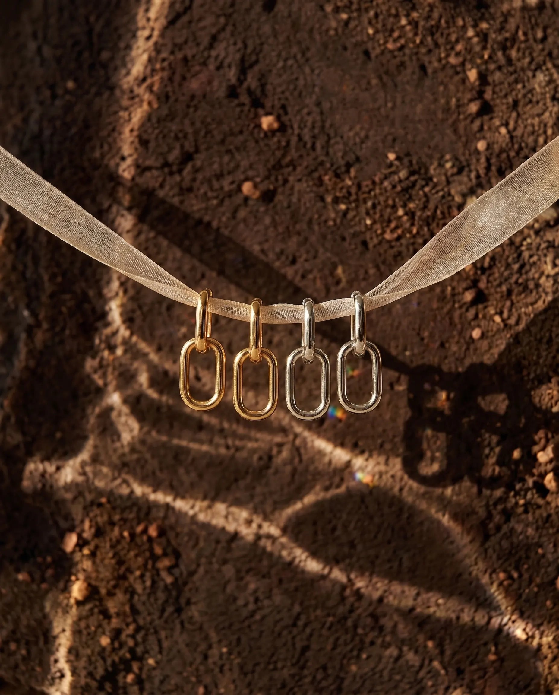 kochi-interlink-drop-earrings-gold-silver-925-luxury, elegant-double-link-hoop-design-aesthetic, high-quality-gold-plated-jewelry-photography, senya-jewelry-best-seller-kochi