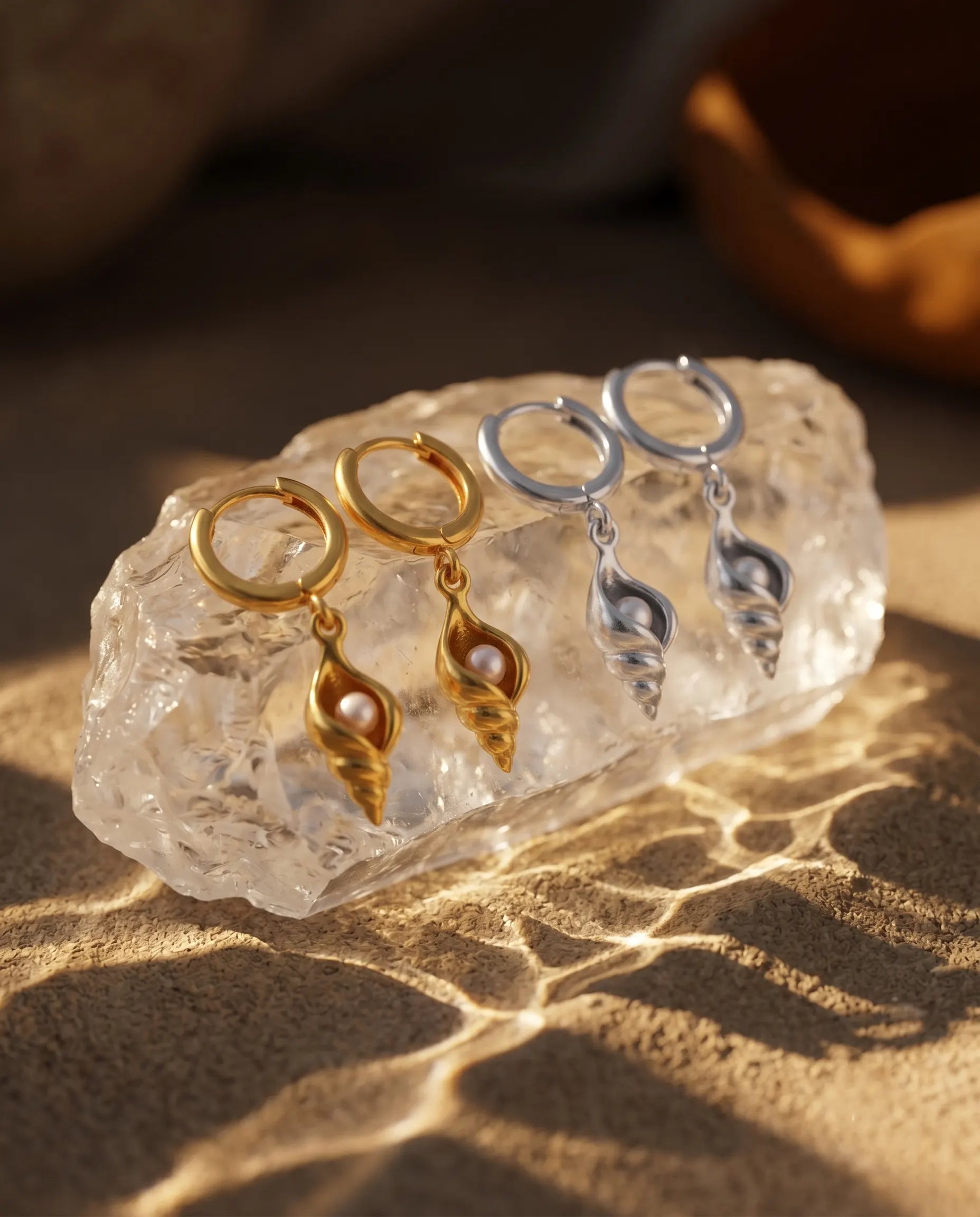 marea-pearl-shell-drop-earrings-captured-in-warm-natural-light-to-emphasize-the-organic-pearl-luster-and-structure