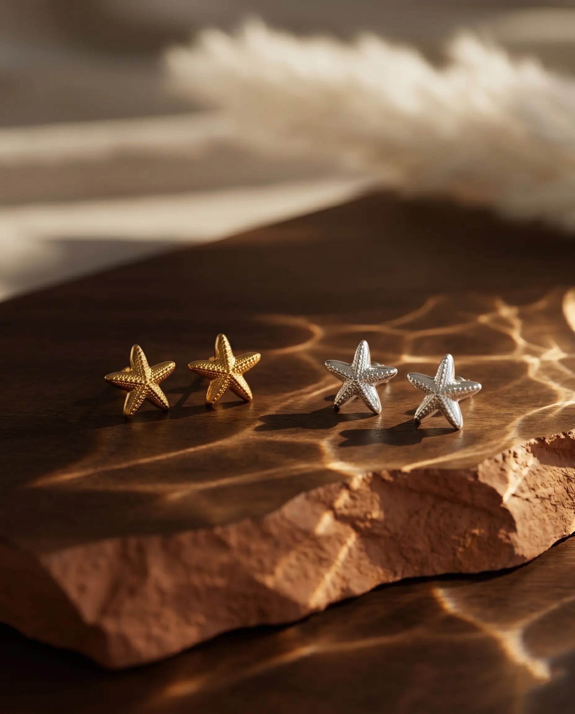 marisol-starfish-stud-earrings-captured-in-warm-natural-light-to-emphasize-the-coastal-minimalist-aesthetic