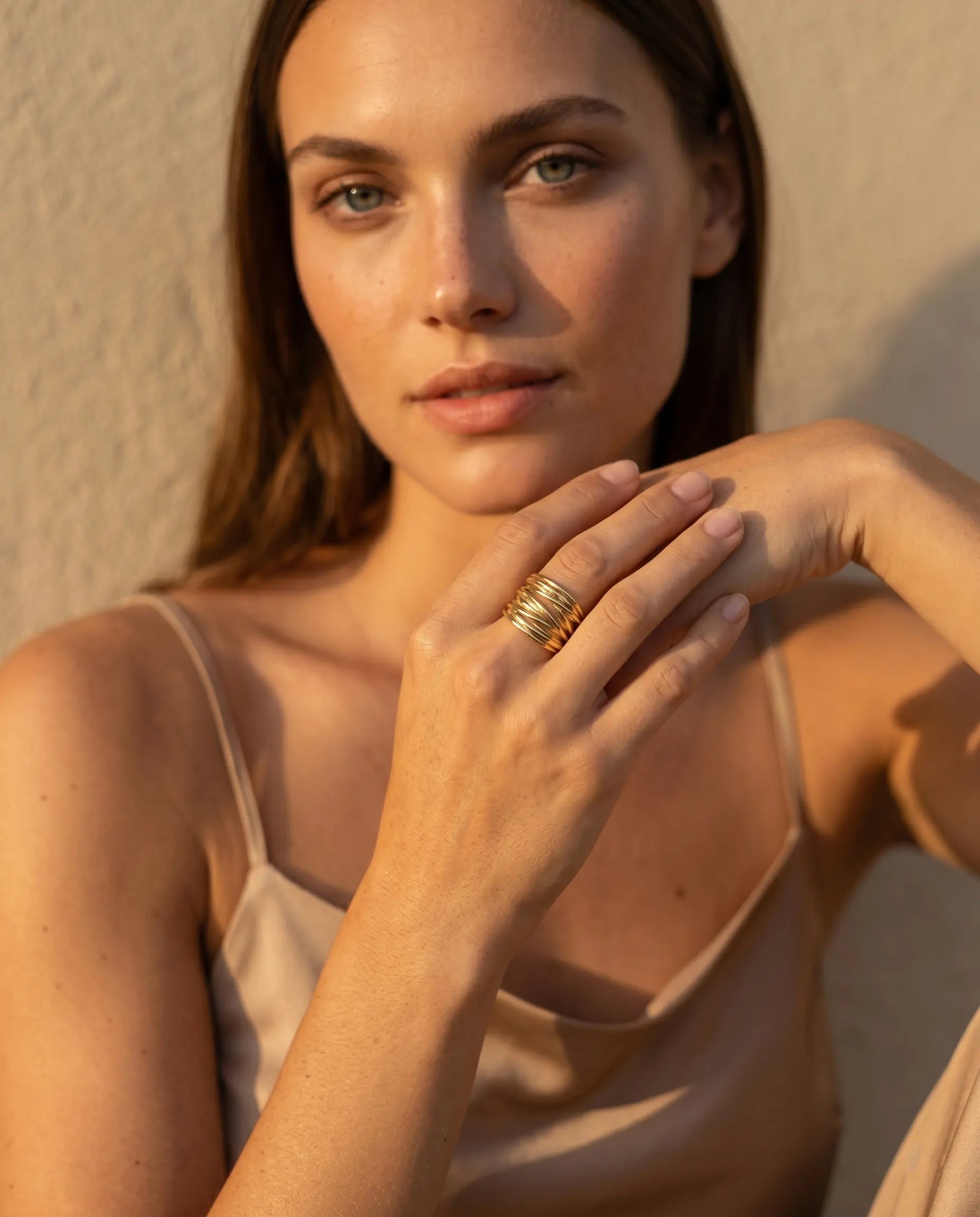 model-wearing-bellora-emerald-cut-silver-ring-lifestyle, elegant-modern-romantic-bridal-jewelry-on-hand, professional-women-luxury-accessories, chic-nature-inspired-ring-styling, luxury-lifestyle-brand-model