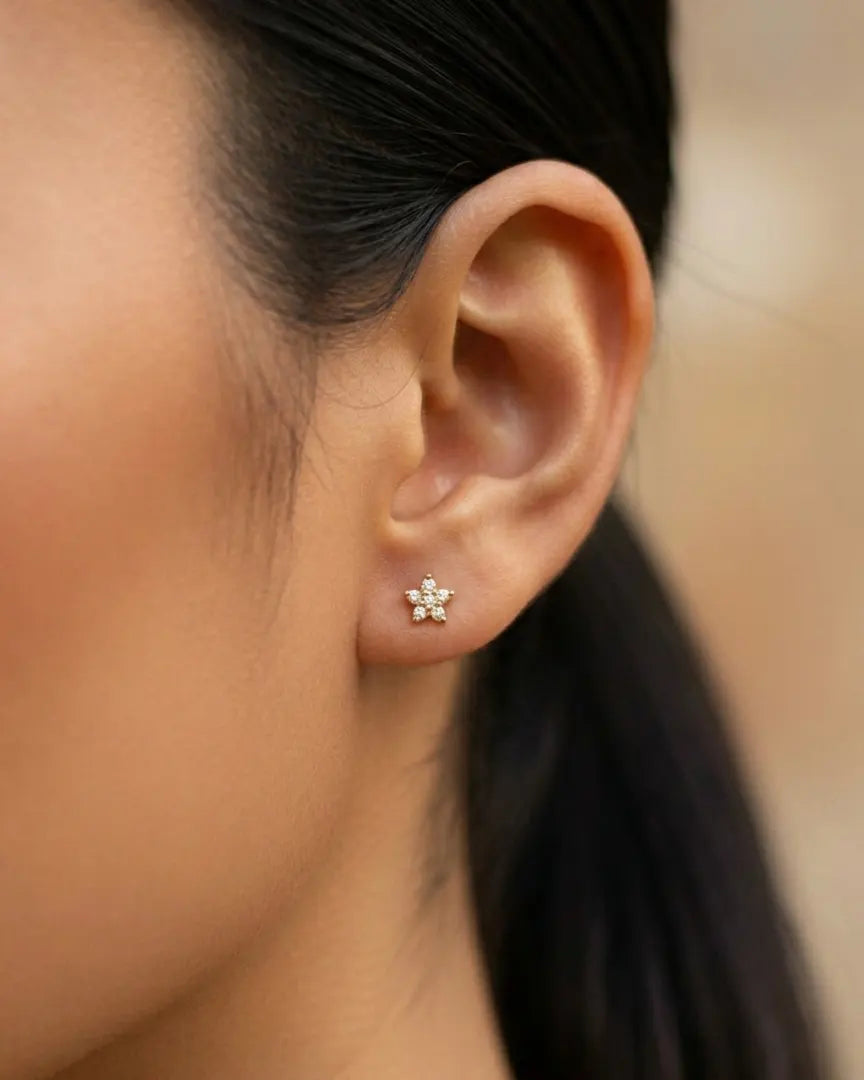 model-wearing-gold-alexa-star-studs, elegant-celestial-sparkle-jewelry-lifestyle, professional-women-luxury-accessories, chic-minimalist-star-earring-photography, luxury-lifestyle-brand-model