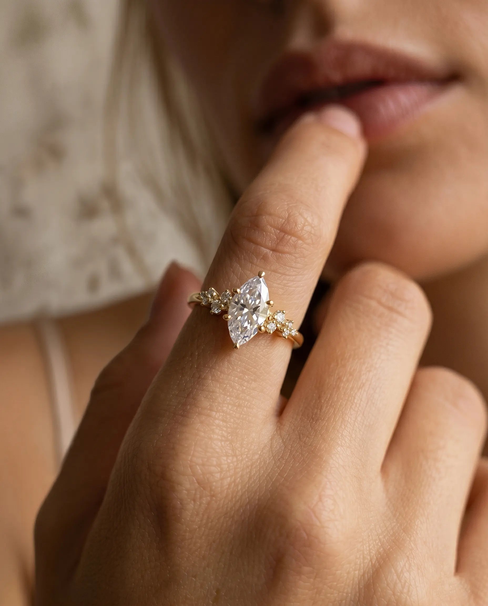 model-wearing-gold-athena-crown-ring-lifestyle, elegant-modern-feminine-jewelry-on-hand, professional-women-luxury-accessories, chic-marquise-gold-styling, luxury-lifestyle-brand-model