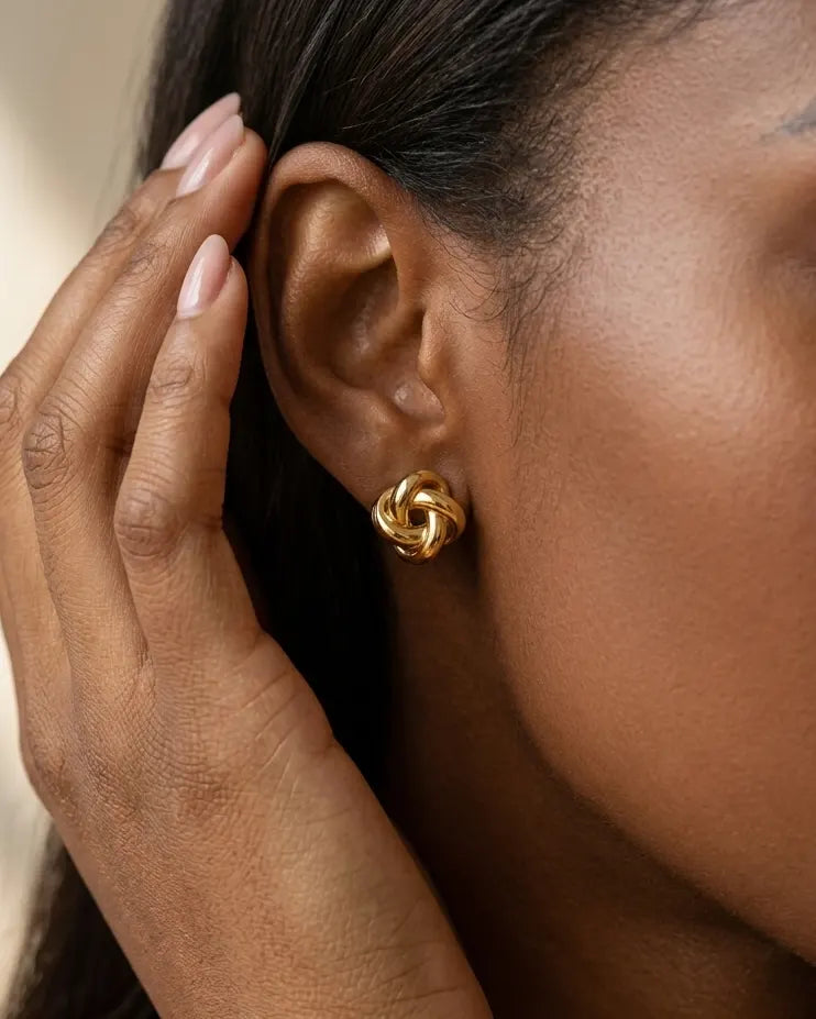 model-wearing-gold-barcelona-link-earrings-lifestyle, elegant-modern-feminine-jewelry-on-ear, professional-women-luxury-accessories, chic-geometric-link-styling, luxury-lifestyle-brand-model