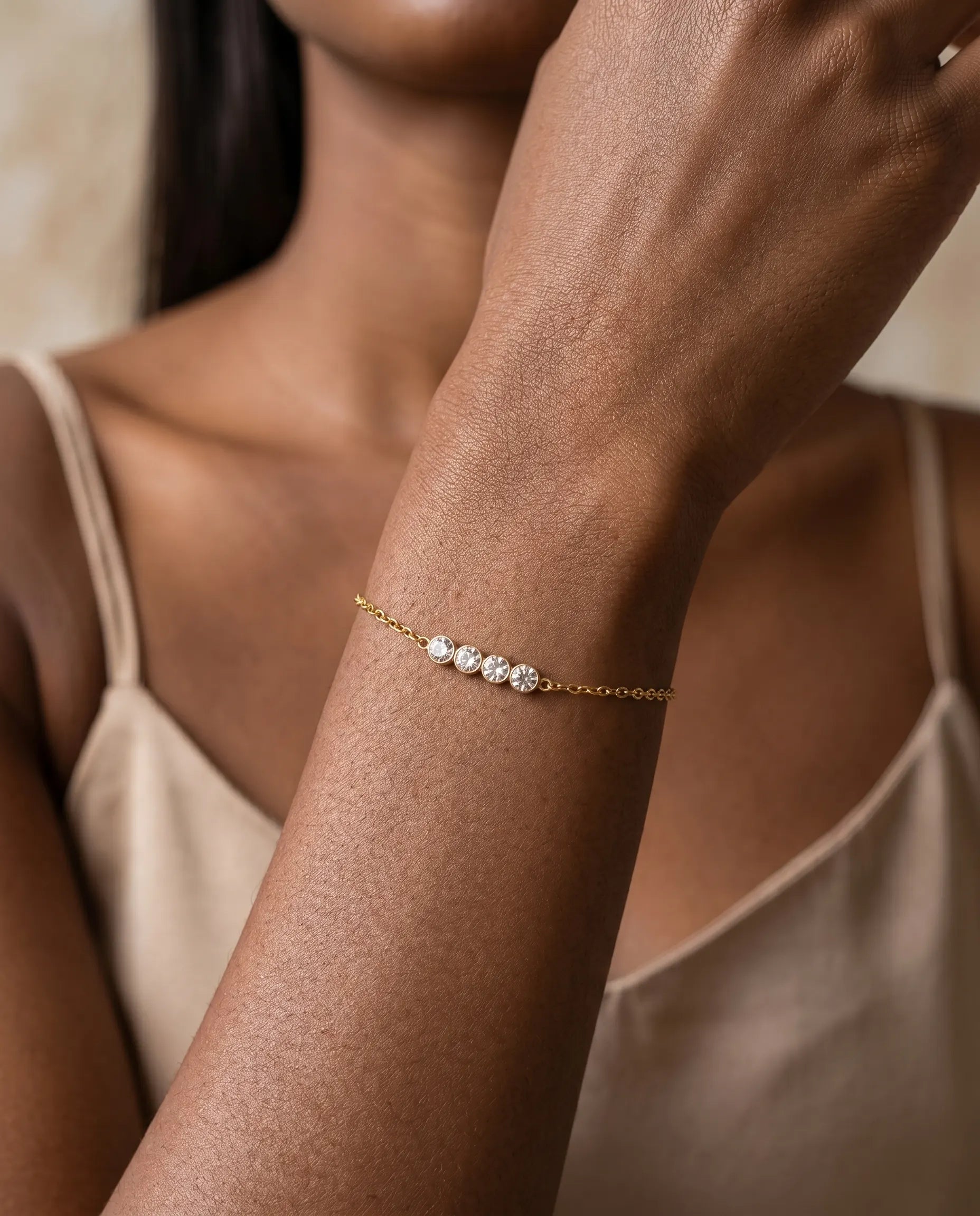 model-wearing-gold-bellima-station-bracelet, elegant-subtle-shine-jewelry-lifestyle, professional-women-luxury-accessories, chic-minimalist-bracelet-stack-photography, luxury-lifestyle-brand-model