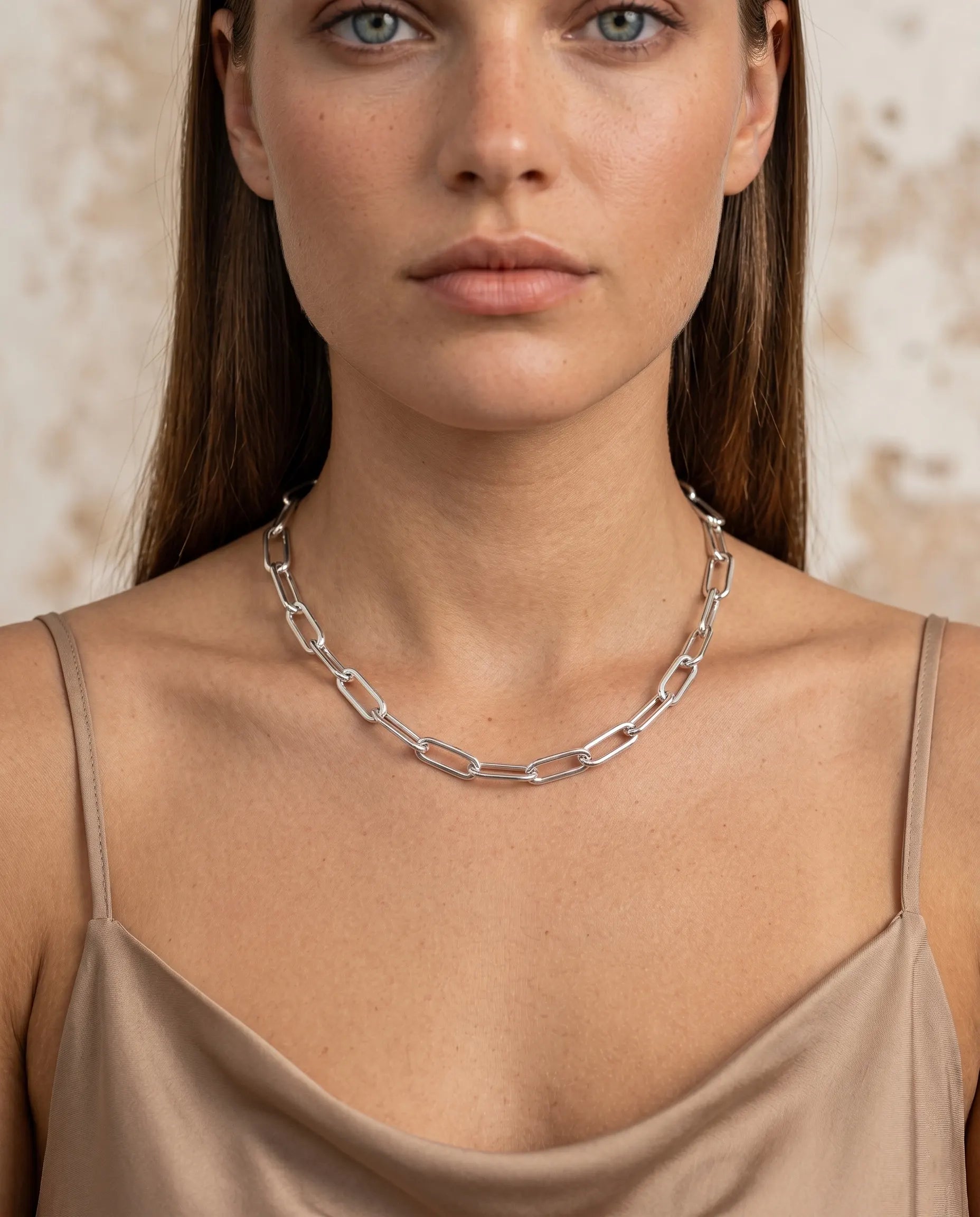model-wearing-gold-bonea-teardrop-necklace-lifestyle, elegant-modern-feminine-jewelry-on-neck, professional-women-luxury-accessories, chic-gold-sculptural-pendant-styling, luxury-lifestyle-brand-model