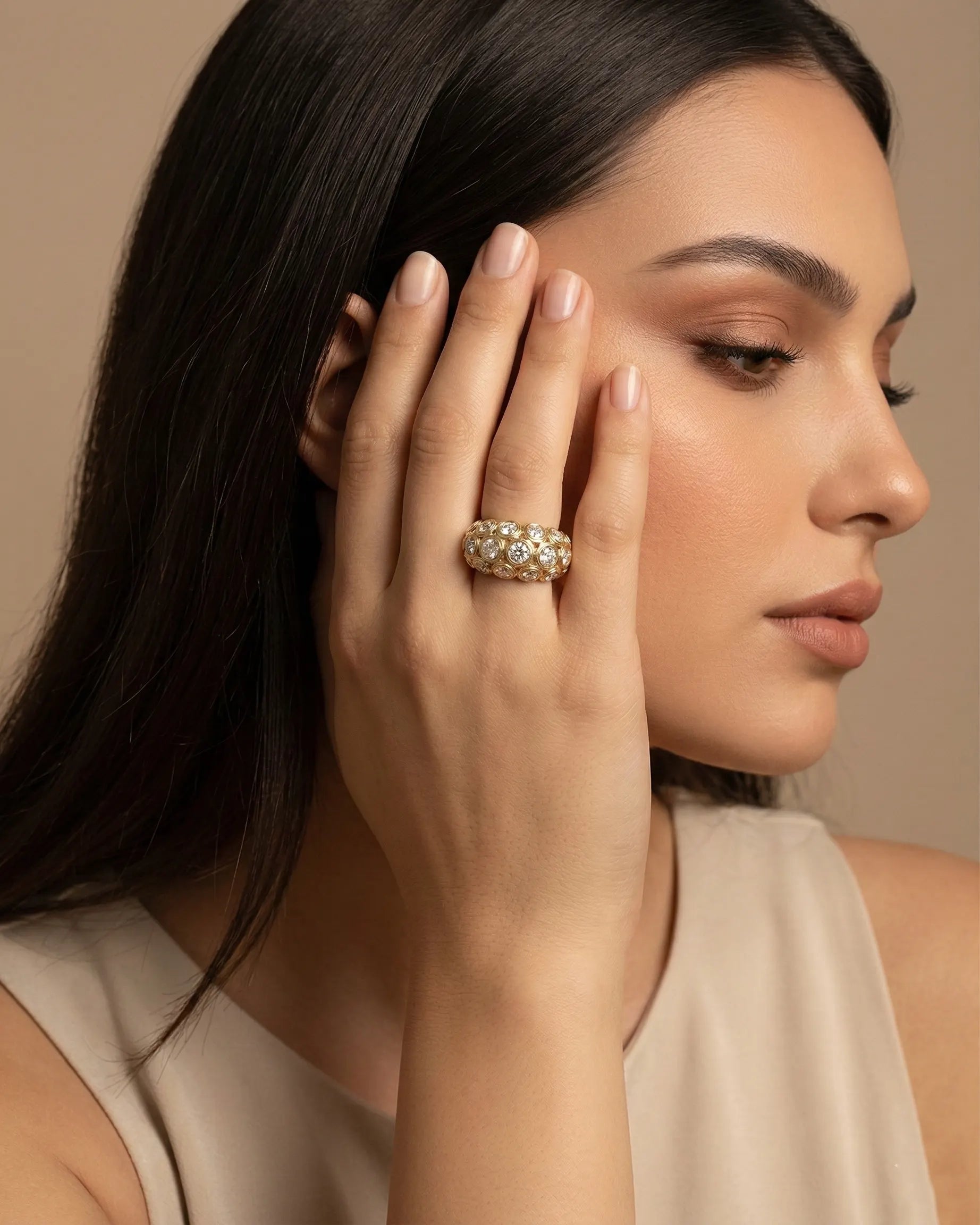 model-wearing-gold-calytrix-oval-halo-ring-lifestyle, elegant-modern-celestial-jewelry-on-hand, professional-women-luxury-accessories, chic-gold-solitaire-styling, luxury-lifestyle-brand-model