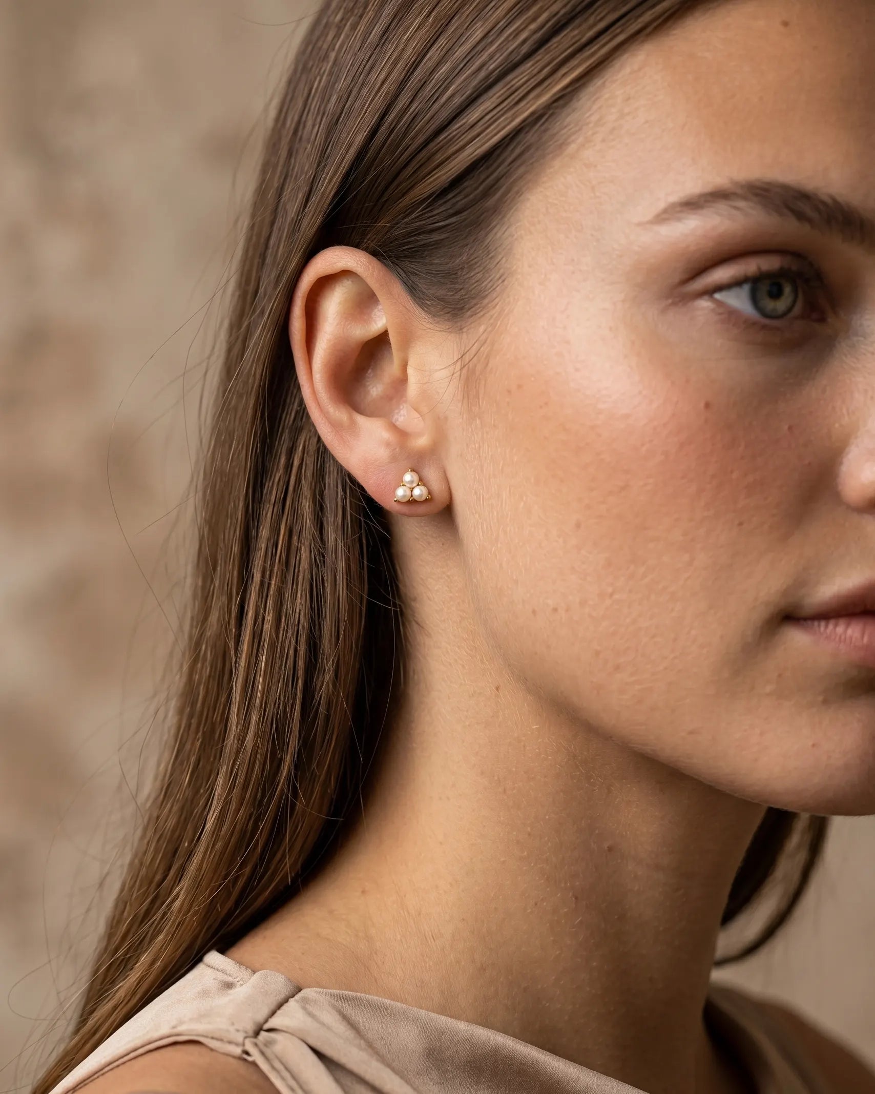 model-wearing-gold-elite-baroque-pearl-earrings-lifestyle, elegant-modern-feminine-jewelry-on-ear, professional-women-luxury-accessories, chic-chunky-pearl-gold-styling, luxury-lifestyle-brand-model