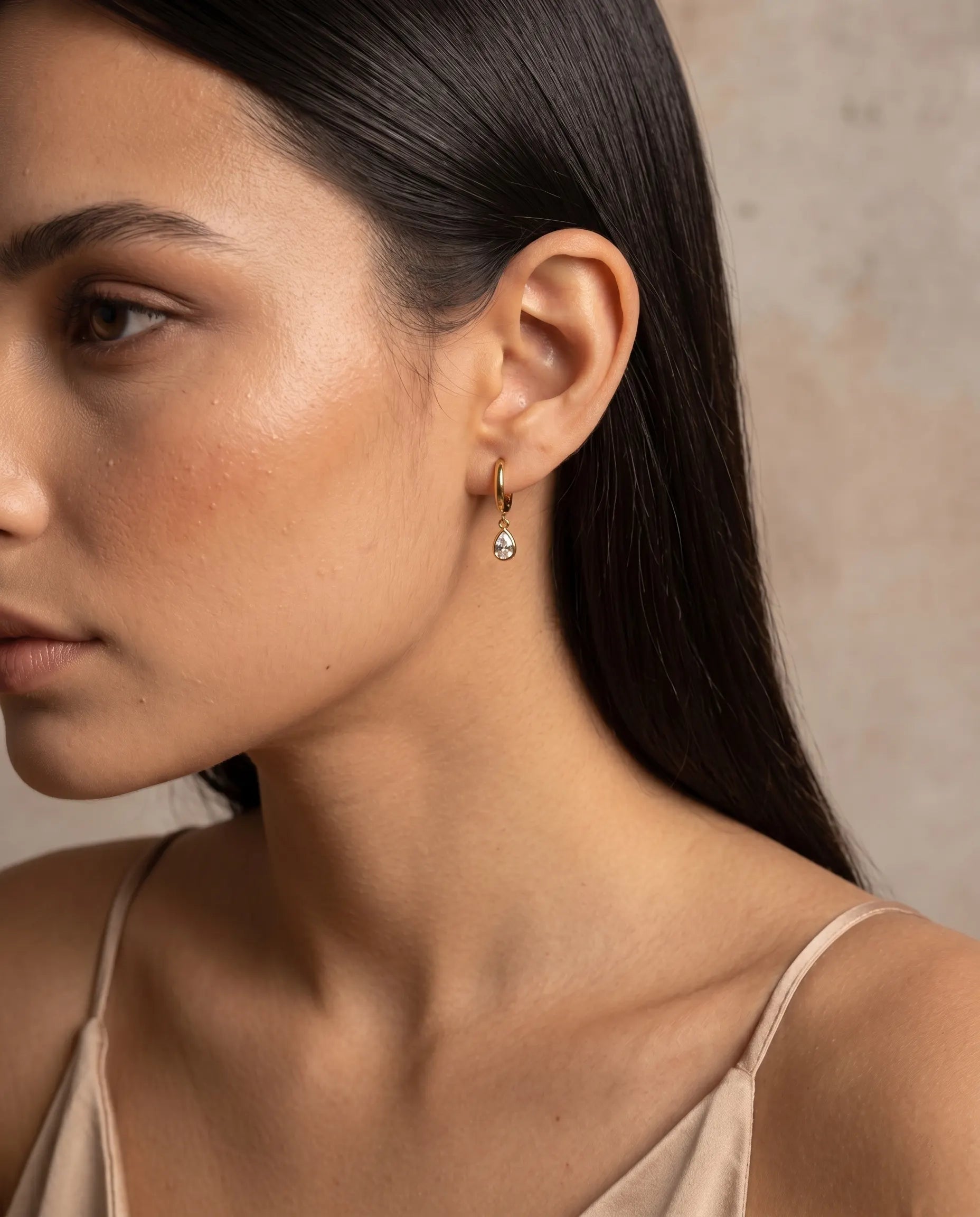 model-wearing-gold-fairy-teardrop-huggie-earrings, elegant-sparkling-jewelry-lifestyle, professional-women-delicate-earrings, chic-minimalist-accessories-photography, luxury-lifestyle-brand-model, premium-crystal-drop-huggies