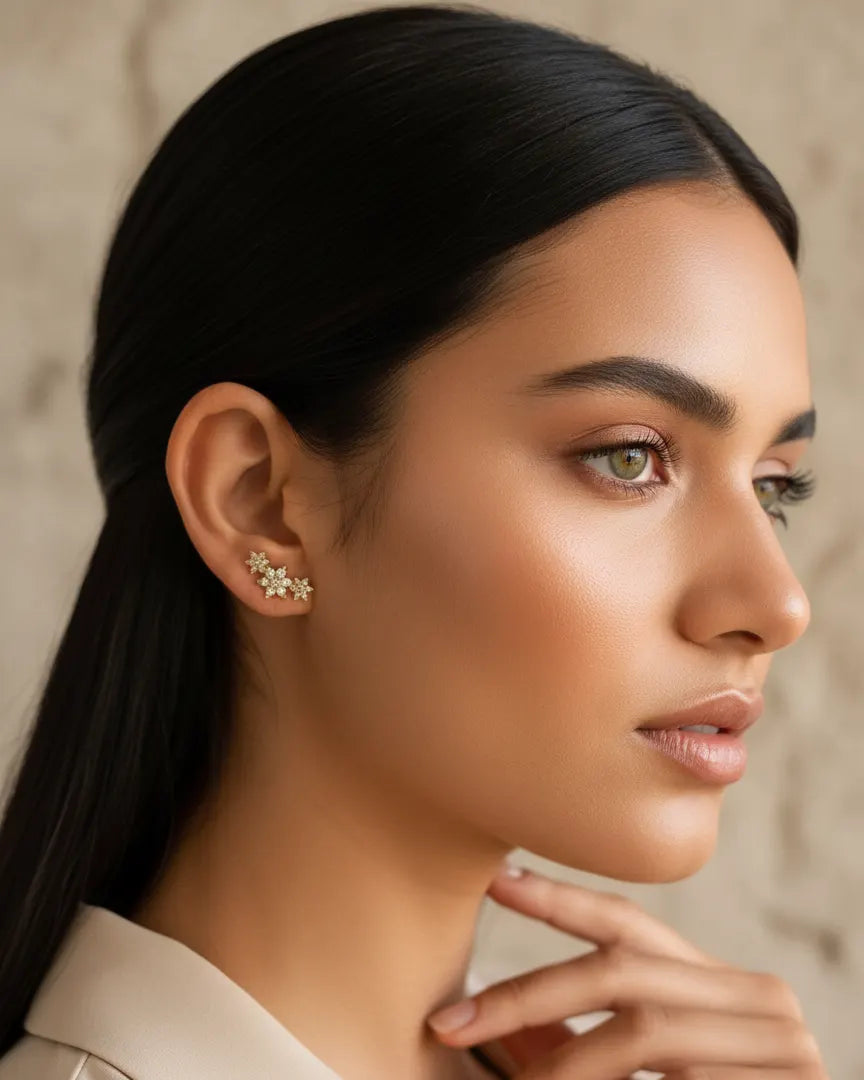 model-wearing-gold-flower-stud-earrings, elegant-feminine-jewelry-lifestyle, dainty-sparkle-earrings-on-ear, professional-women-floral-jewelry, luxury-lifestyle-brand-photography, chic-minimalist-accessories-model