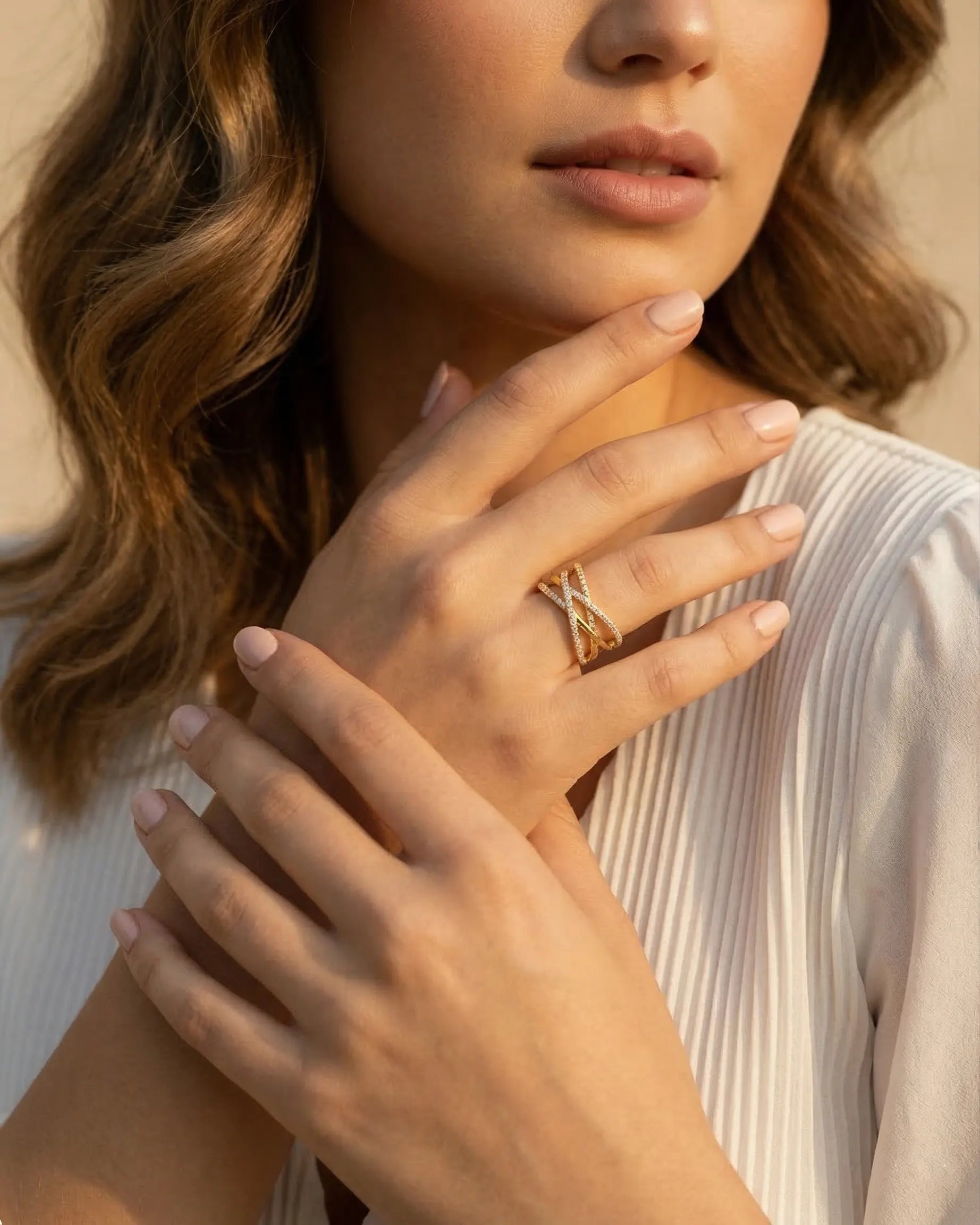 model-wearing-gold-icon-triple-band-ring-lifestyle, elegant-bold-feminine-jewelry-on-hand, professional-women-luxury-accessories, chic-pavé-gold-styling, luxury-lifestyle-brand-model