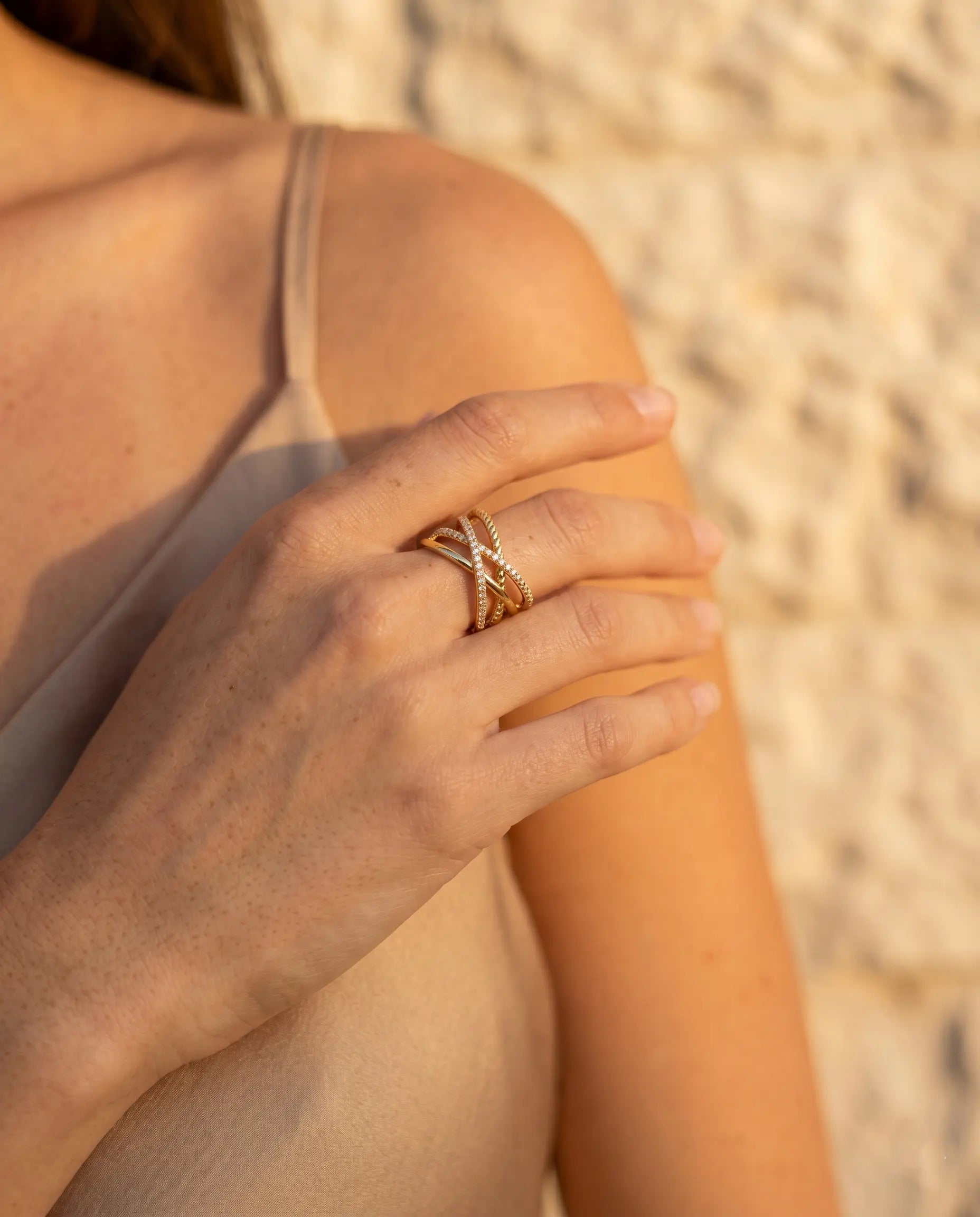 model-wearing-gold-icon-triple-band-ring-lifestyle, elegant-bold-feminine-jewelry-on-hand, professional-women-luxury-accessories, chic-pavé-gold-styling, luxury-lifestyle-brand-model