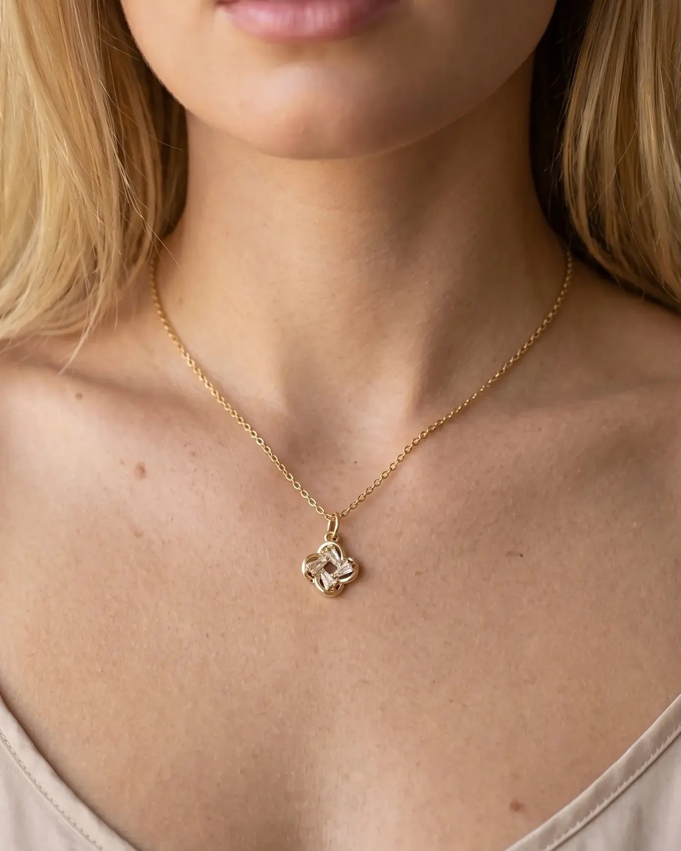 model-wearing-gold-juliet-heart-necklace-lifestyle, elegant-modern-feminine-jewelry-on-neck, professional-women-luxury-accessories, chic-gold-heart-pendant-styling, luxury-lifestyle-brand-model