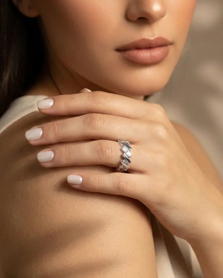 model-wearing-gold-kaori-crossover-ring-lifestyle, elegant-modern-architectural-jewelry-on-hand, professional-women-luxury-accessories, chic-gold-eternity-band-styling, luxury-lifestyle-brand-model