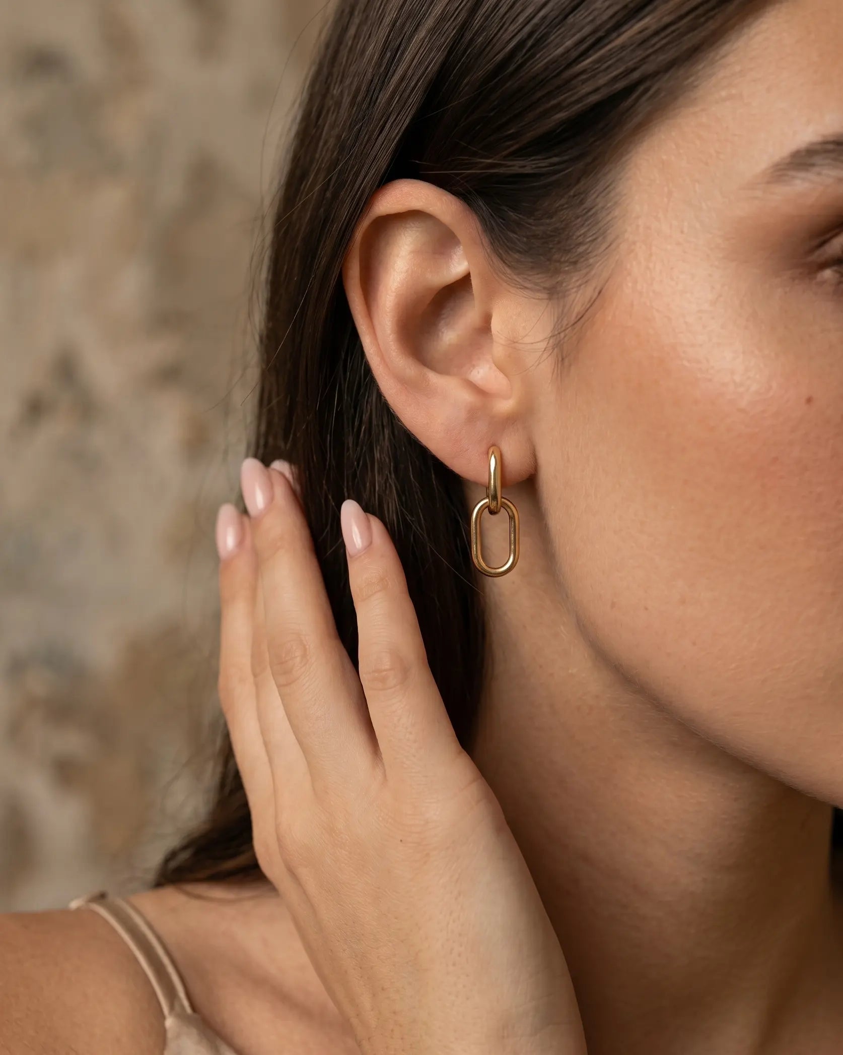 model-wearing-gold-kochi-interlink-earrings-lifestyle, elegant-modern-silhouette-jewelry-on-ear, professional-women-minimalist-accessories, chic-double-link-earring-photography, luxury-lifestyle-brand-model