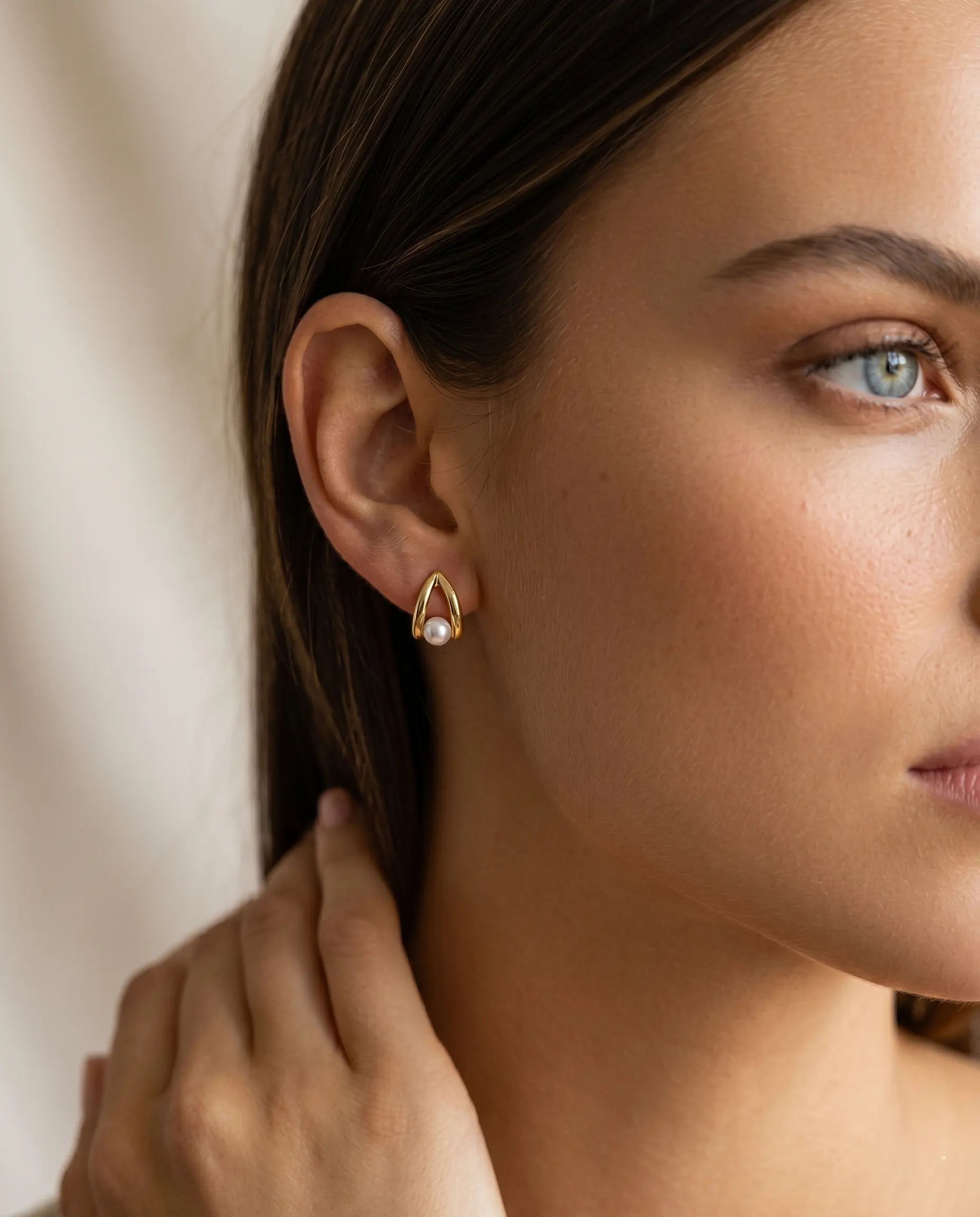model-wearing-gold-lace-pearl-triangle-earrings-lifestyle, elegant-modern-feminine-jewelry-on-ear, professional-women-luxury-accessories, chic-geometric-pearl-styling, luxury-lifestyle-brand-model