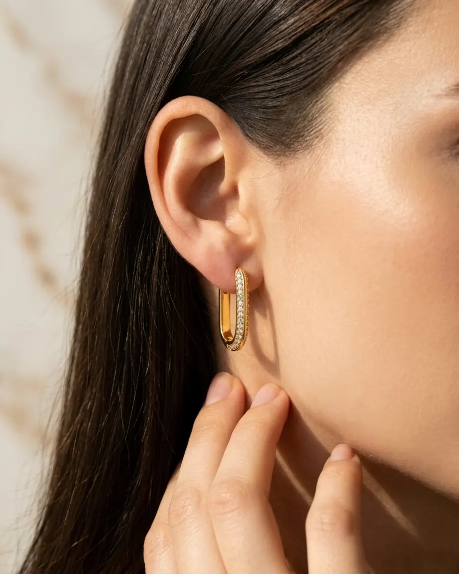 model-wearing-gold-lennon-rectangular-hoop-earrings-lifestyle, elegant-modern-feminine-jewelry-on-ear, professional-women-luxury-accessories, chic-geometric-gold-hoop-styling, luxury-lifestyle-brand-model