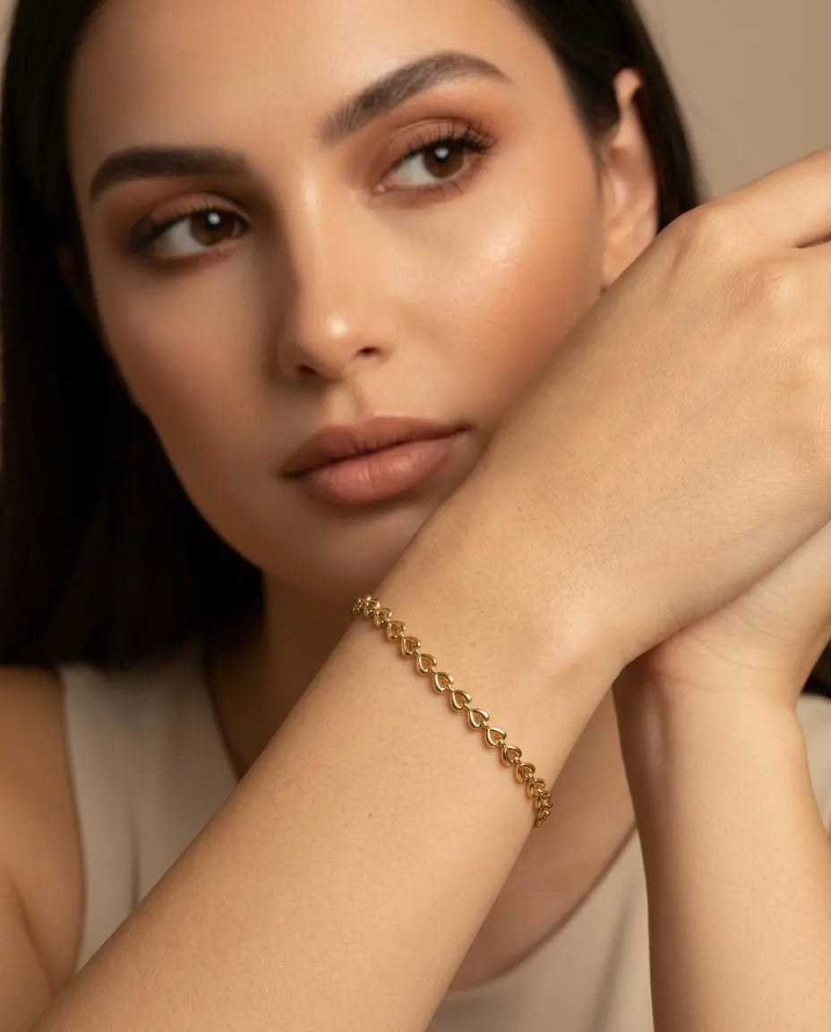 model-wearing-gold-odessa-link-bracelet-lifestyle, elegant-modern-feminine-jewelry-on-wrist, professional-women-luxury-accessories, chic-gold-chain-bracelet-styling, luxury-lifestyle-brand-model