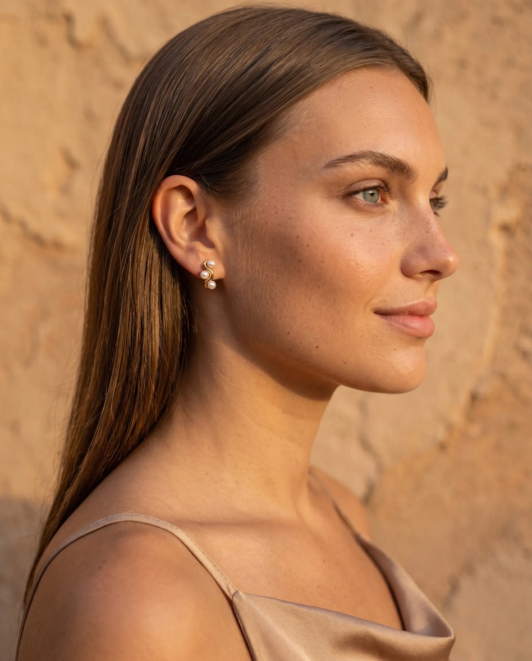 model-wearing-gold-pearl-hoop-earrings, elegant-feminine-jewelry-lifestyle, dainty-pearl-drop-earrings-on-ear, professional-women-pearl-jewelry, luxury-lifestyle-brand-photography, chic-minimalist-accessories-model