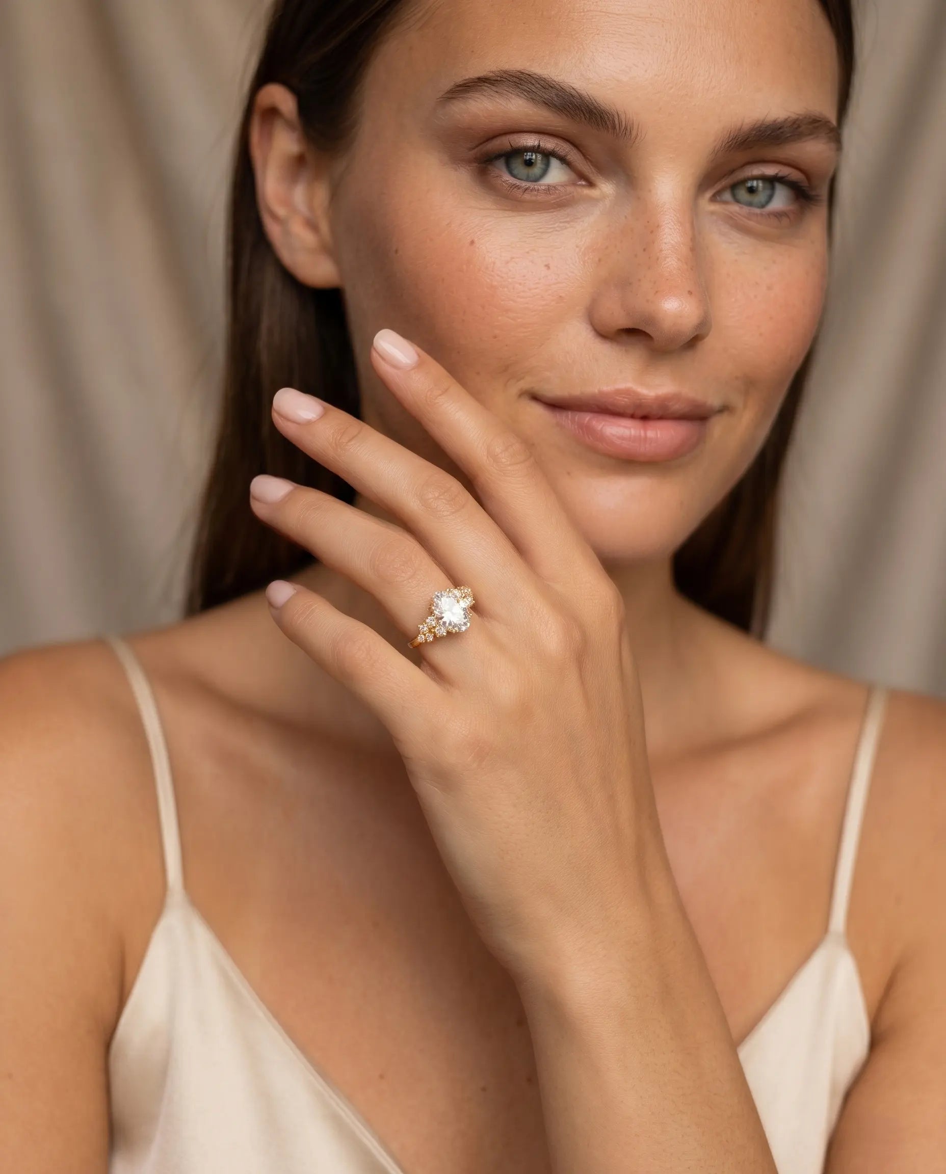 model-wearing-gold-scarlet-cluster-ring-lifestyle, elegant-modern-radiance-jewelry-on-hand, professional-women-luxury-accessories, chic-oval-zirconia-halo-ring-photography, luxury-lifestyle-brand-model