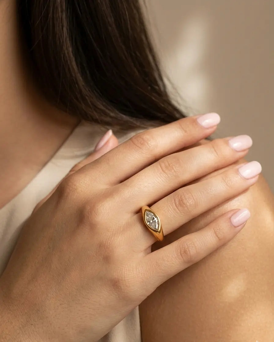 model-wearing-gold-selah-marquise-ring-lifestyle, elegant-bold-radiance-jewelry-on-hand, professional-women-luxury-accessories, chic-marquise-cut-zirconia-ring-photography, luxury-lifestyle-brand-model