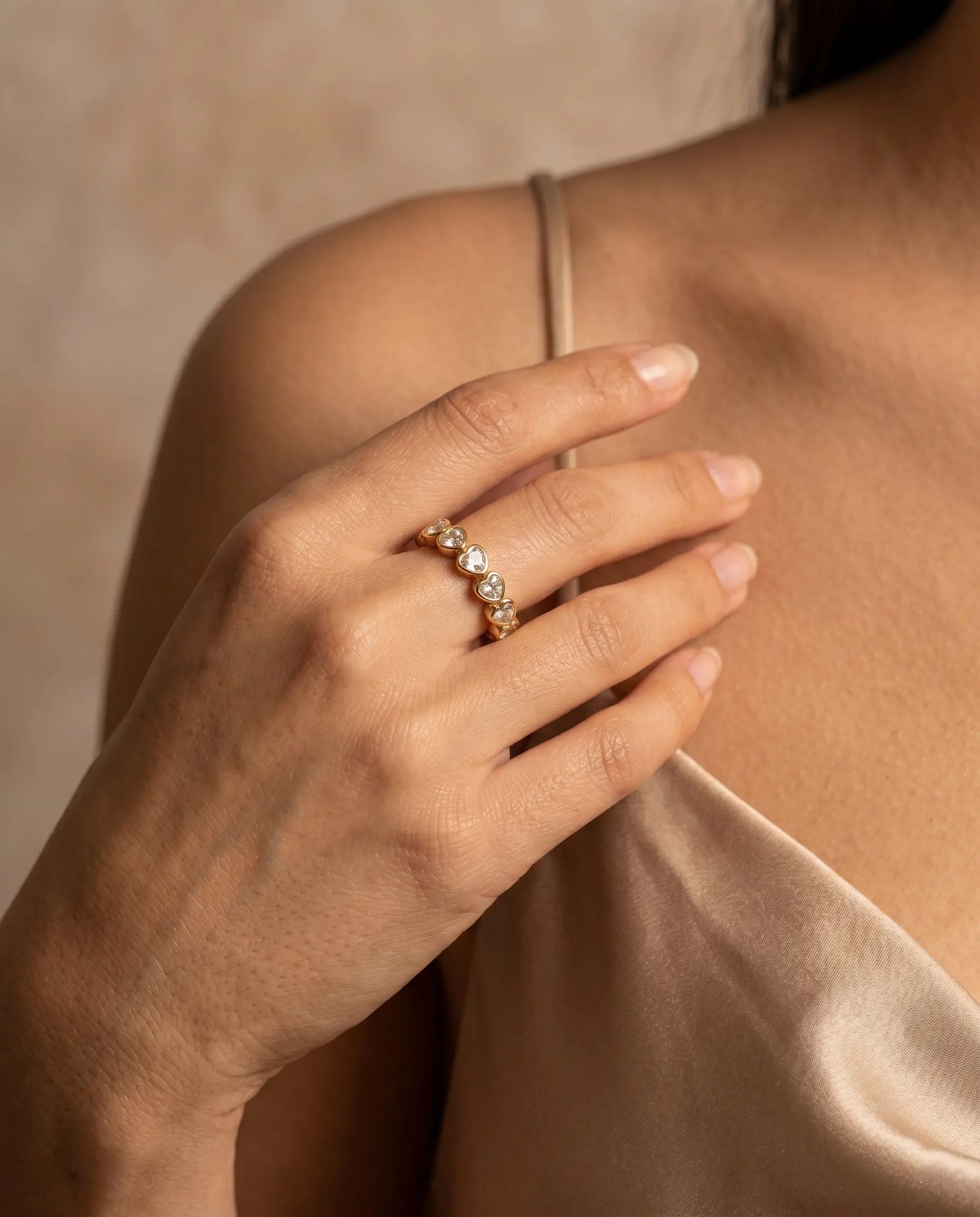 model-wearing-gold-siena-baguette-ring-lifestyle, elegant-modern-feminine-jewelry-on-hand, professional-women-luxury-accessories, chic-baguette-crystal-ring-styling, luxury-lifestyle-brand-model