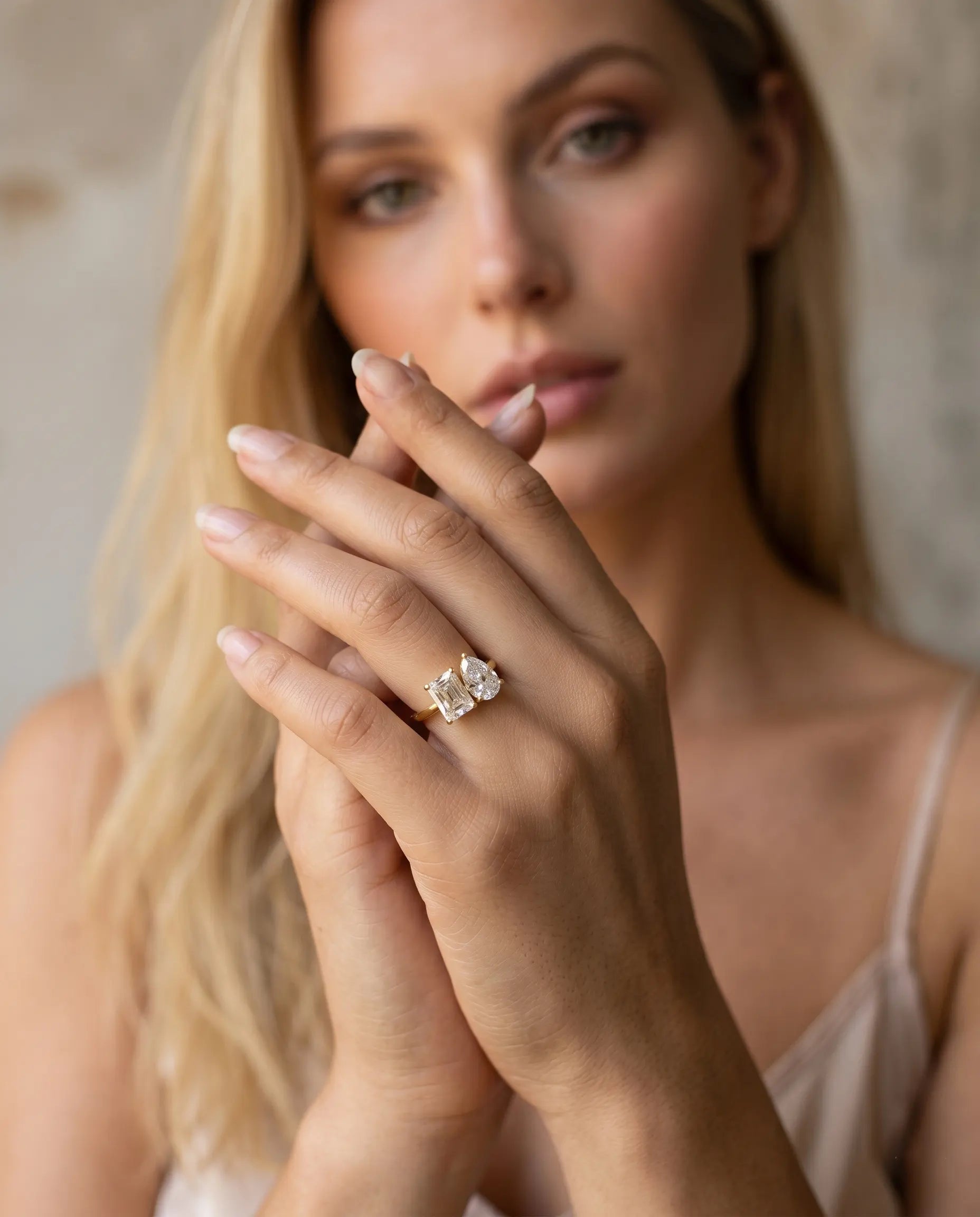 model-wearing-gold-sunday-double-stone-ring-lifestyle, elegant-modern-feminine-jewelry-on-hand, professional-women-luxury-accessories, chic-gold-bypass-ring-styling, luxury-lifestyle-brand-model