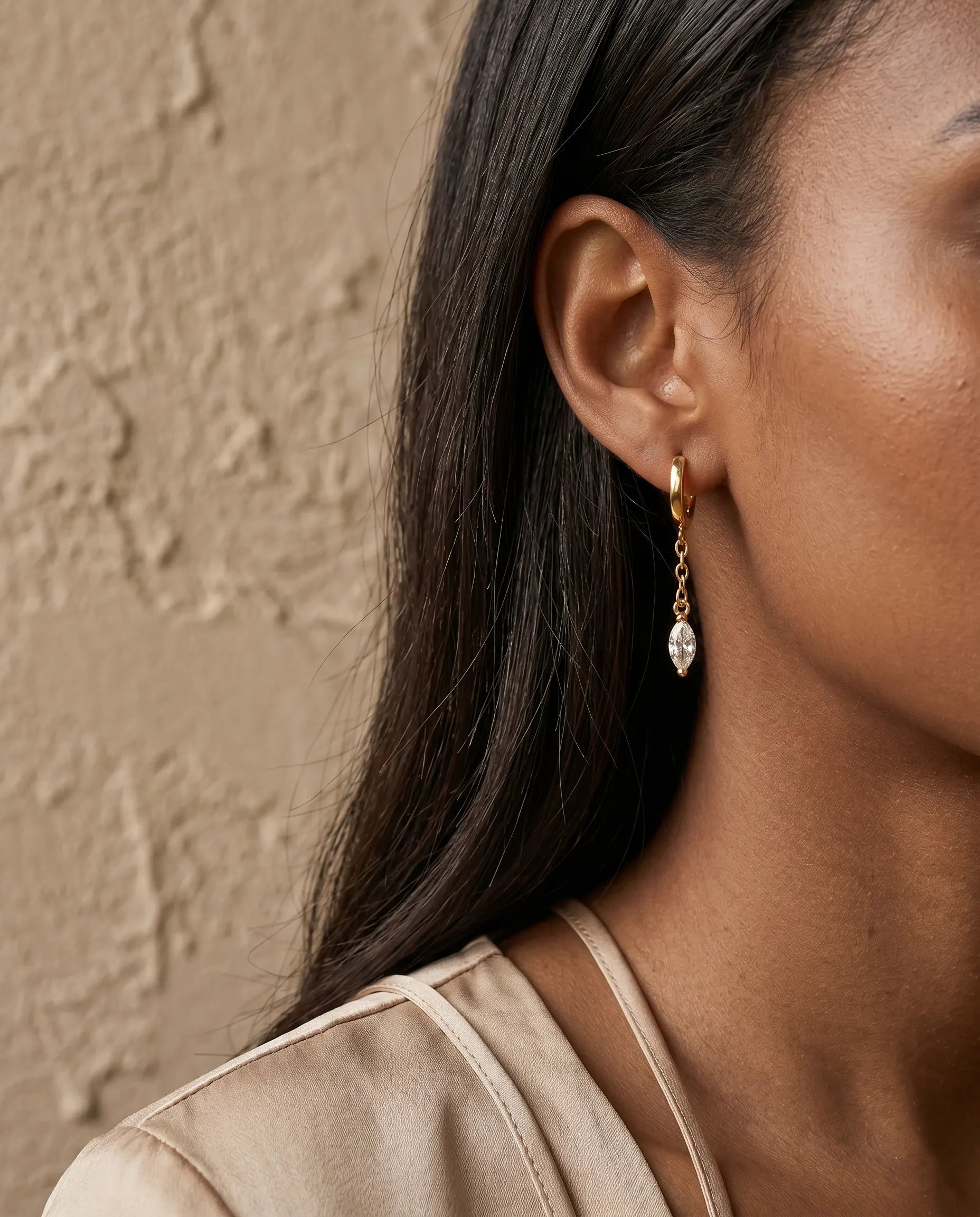 model-wearing-silver-angelique-marquise-drops, elegant-captivating-movement-jewelry-lifestyle, professional-women-luxury-accessories, chic-marquise-cut-earring-photography, luxury-lifestyle-brand-model