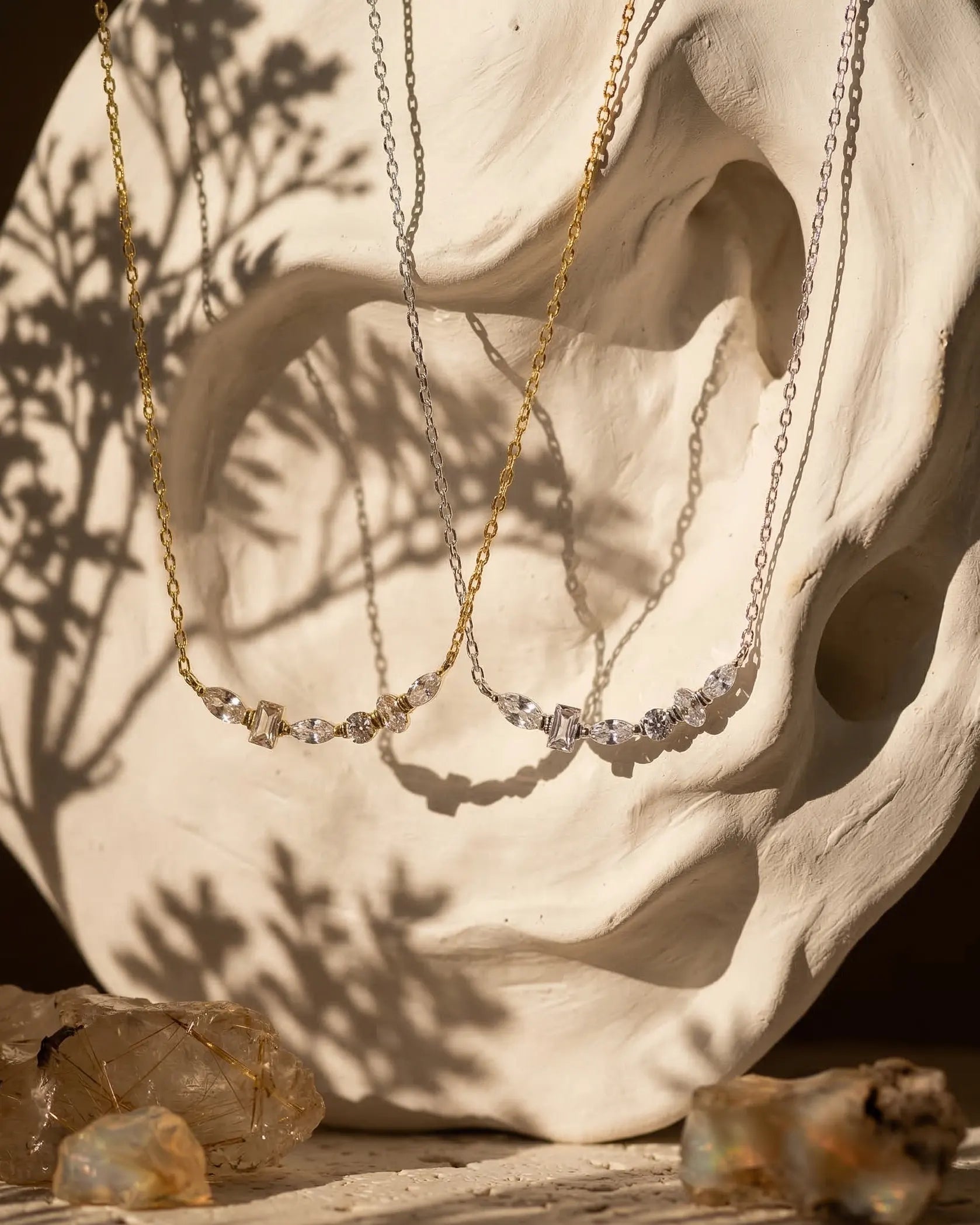 model-wearing-silver-donna-baguette-necklace-lifestyle, elegant-modern-feminine-jewelry-on-neck, professional-women-luxury-accessories, chic-sparkling-statement-necklace-styling, luxury-lifestyle-brand-model