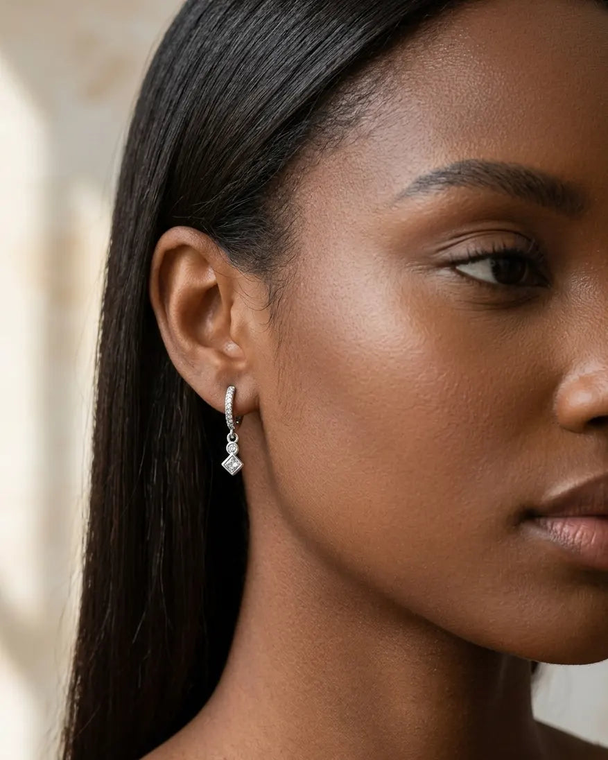 model-wearing-silver-mercedes-star-hoop-earrings-lifestyle, elegant-modern-feminine-jewelry-on-ear, professional-women-luxury-accessories, chic-celestial-silver-styling, luxury-lifestyle-brand-model
