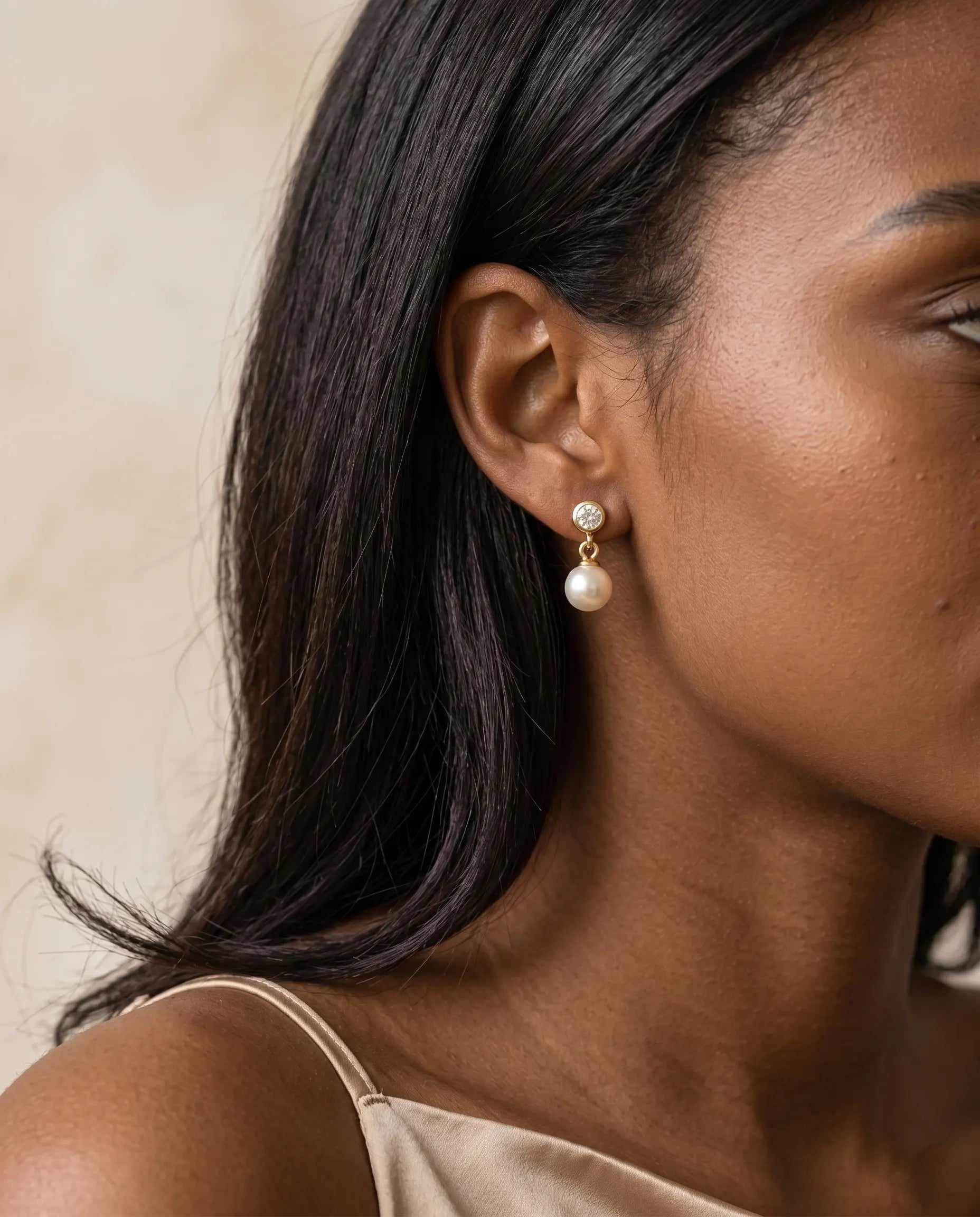 model-wearing-silver-romy-crystal-drop-earrings-lifestyle, elegant-modern-feminine-jewelry-on-ear, professional-women-luxury-accessories, chic-solitaire-silver-styling, luxury-lifestyle-brand-model