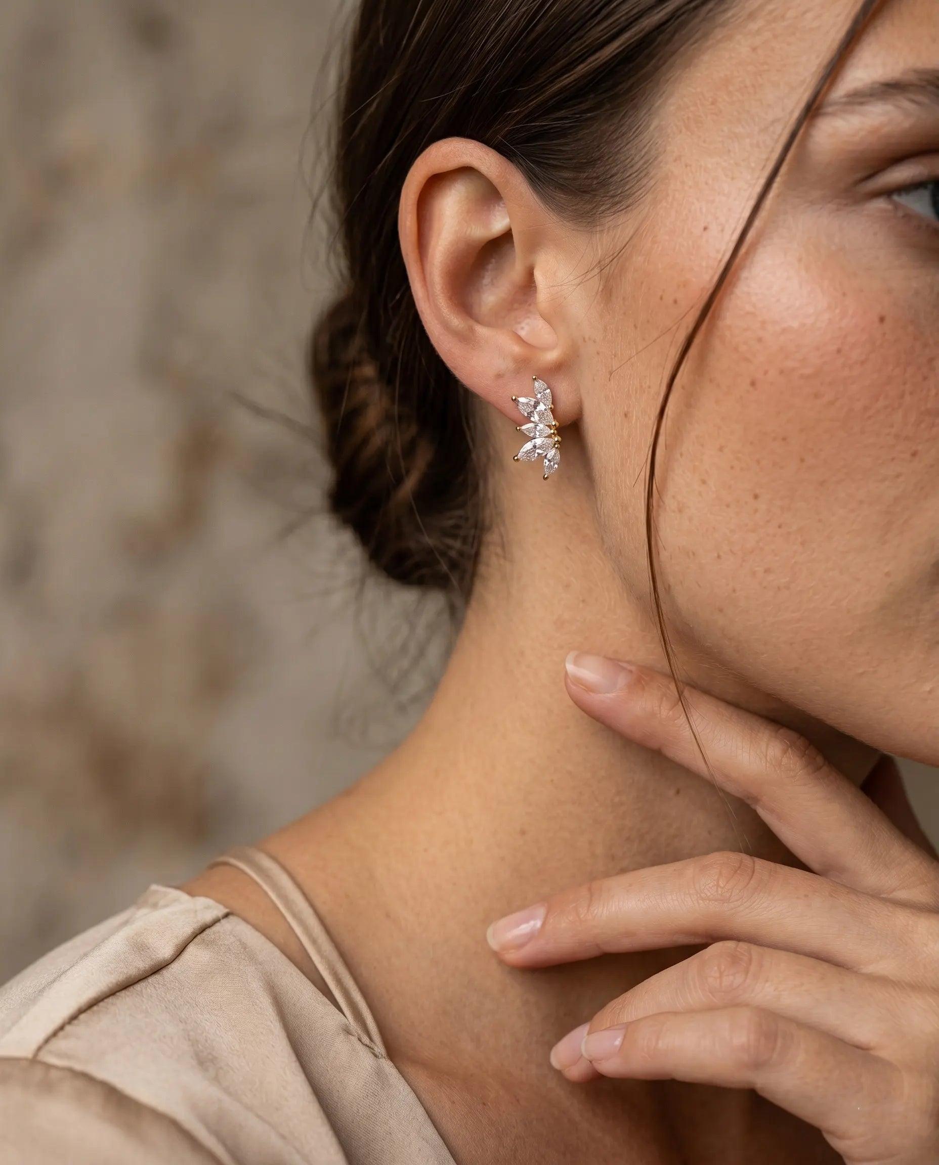 model-wearing-the-bliss-crystal-bloom-earrings-showcasing-sophisticated-minimalist-ear-styling