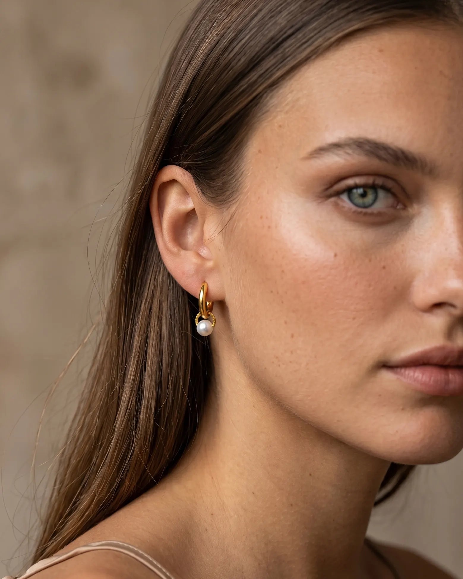 model-wearing-the-palma-pearl-drop-huggie-hoops-showcasing-sophisticated-minimalist-ear-styling
