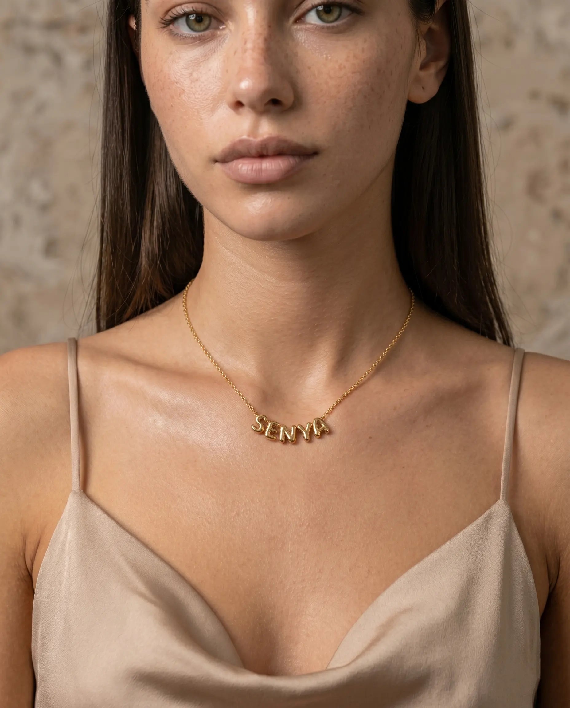 model-wearing-the-poppy-custom-name-necklace-personalized-jewelry-styling-minimalist-aesthetic