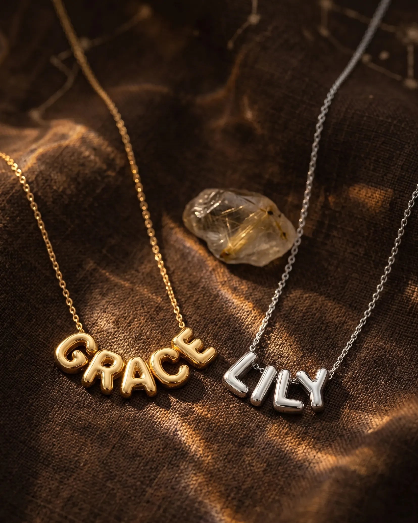 poppy-custom-name-necklaces-in-gold-and-silver-side-by-side-minimalist-jewelry-photography-for-senya
